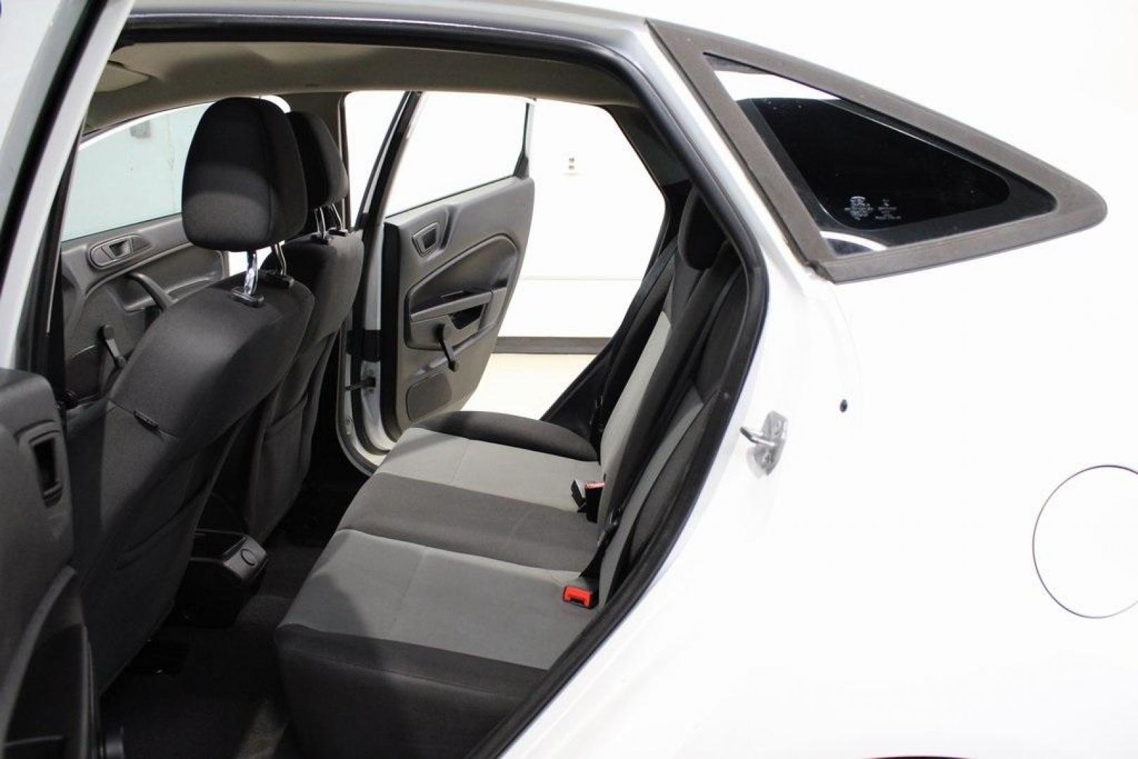 2017 Oxford White /Black Ford Fiesta S (3FADP4AJ9HM) with an 1.6L I4 Ti-VCT engine, Automatic transmission, located at 15300 Midway Rd., Addison, TX, 75001, (972) 702-0011, 32.958321, -96.838074 - Introducing the 2017 Ford Fiesta S Sedan, now available at Midway Auto Group in Addison, Texas. This compact, efficient, and budget-friendly sedan is designed for everyday drivability. Whether you're commuting to work or searching for a reliable first car, the Fiesta delivers dependable performance - Photo#14