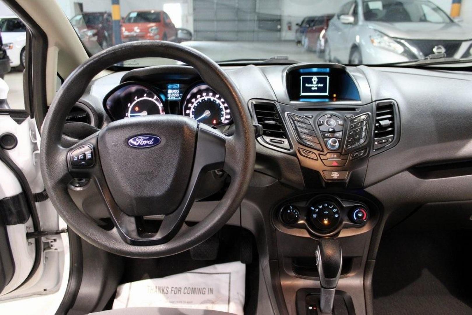 2017 Oxford White /Black Ford Fiesta S (3FADP4AJ9HM) with an 1.6L I4 Ti-VCT engine, Automatic transmission, located at 15300 Midway Rd., Addison, TX, 75001, (972) 702-0011, 32.958321, -96.838074 - Introducing the 2017 Ford Fiesta S Sedan, now available at Midway Auto Group in Addison, Texas. This compact, efficient, and budget-friendly sedan is designed for everyday drivability. Whether you're commuting to work or searching for a reliable first car, the Fiesta delivers dependable performance - Photo#15