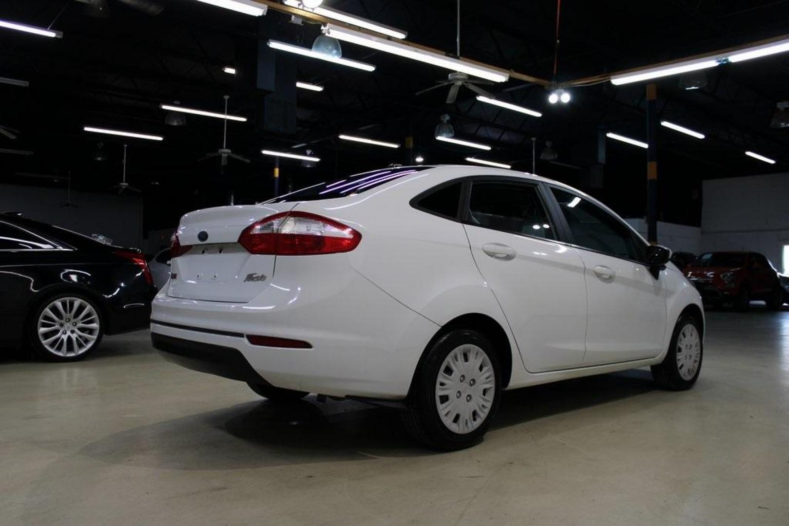2017 Oxford White /Black Ford Fiesta S (3FADP4AJ9HM) with an 1.6L I4 Ti-VCT engine, Automatic transmission, located at 15300 Midway Rd., Addison, TX, 75001, (972) 702-0011, 32.958321, -96.838074 - Introducing the 2017 Ford Fiesta S Sedan, now available at Midway Auto Group in Addison, Texas. This compact, efficient, and budget-friendly sedan is designed for everyday drivability. Whether you're commuting to work or searching for a reliable first car, the Fiesta delivers dependable performance - Photo#2