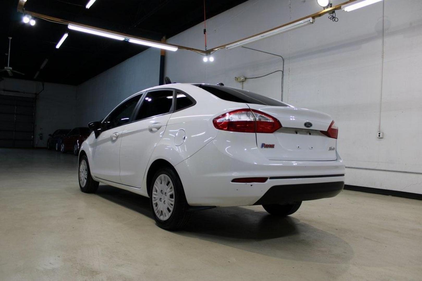 2017 Oxford White /Black Ford Fiesta S (3FADP4AJ9HM) with an 1.6L I4 Ti-VCT engine, Automatic transmission, located at 15300 Midway Rd., Addison, TX, 75001, (972) 702-0011, 32.958321, -96.838074 - Introducing the 2017 Ford Fiesta S Sedan, now available at Midway Auto Group in Addison, Texas. This compact, efficient, and budget-friendly sedan is designed for everyday drivability. Whether you're commuting to work or searching for a reliable first car, the Fiesta delivers dependable performance - Photo#3