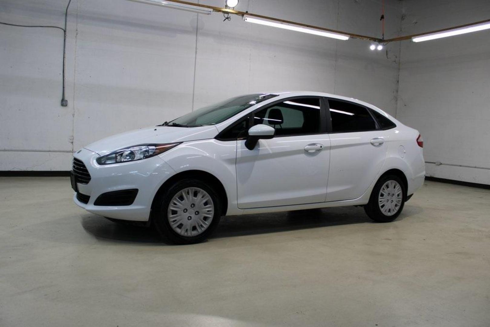 2017 Oxford White /Black Ford Fiesta S (3FADP4AJ9HM) with an 1.6L I4 Ti-VCT engine, Automatic transmission, located at 15300 Midway Rd., Addison, TX, 75001, (972) 702-0011, 32.958321, -96.838074 - Introducing the 2017 Ford Fiesta S Sedan, now available at Midway Auto Group in Addison, Texas. This compact, efficient, and budget-friendly sedan is designed for everyday drivability. Whether you're commuting to work or searching for a reliable first car, the Fiesta delivers dependable performance - Photo#4