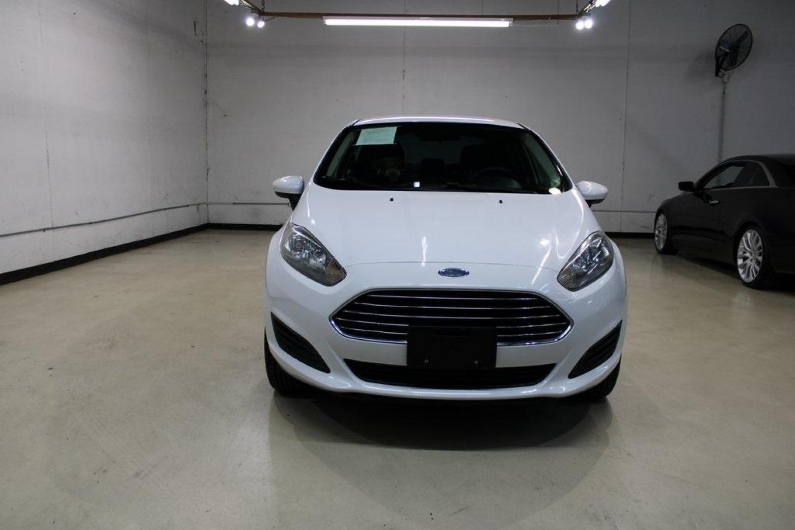 2017 Oxford White /Black Ford Fiesta S (3FADP4AJ9HM) with an 1.6L I4 Ti-VCT engine, Automatic transmission, located at 15300 Midway Rd., Addison, TX, 75001, (972) 702-0011, 32.958321, -96.838074 - Introducing the 2017 Ford Fiesta S Sedan, now available at Midway Auto Group in Addison, Texas. This compact, efficient, and budget-friendly sedan is designed for everyday drivability. Whether you're commuting to work or searching for a reliable first car, the Fiesta delivers dependable performance - Photo#5