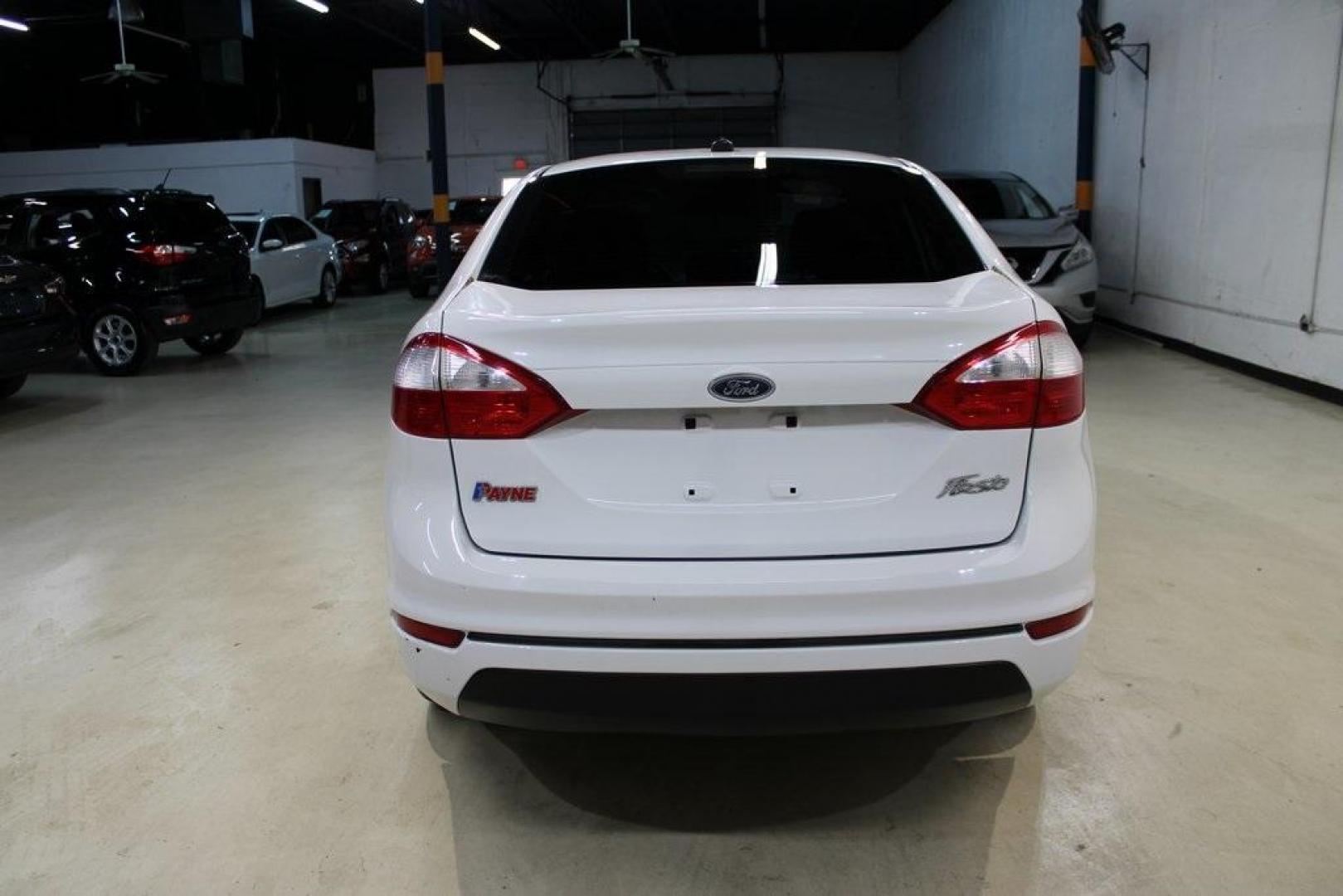 2017 Oxford White /Black Ford Fiesta S (3FADP4AJ9HM) with an 1.6L I4 Ti-VCT engine, Automatic transmission, located at 15300 Midway Rd., Addison, TX, 75001, (972) 702-0011, 32.958321, -96.838074 - Introducing the 2017 Ford Fiesta S Sedan, now available at Midway Auto Group in Addison, Texas. This compact, efficient, and budget-friendly sedan is designed for everyday drivability. Whether you're commuting to work or searching for a reliable first car, the Fiesta delivers dependable performance - Photo#7