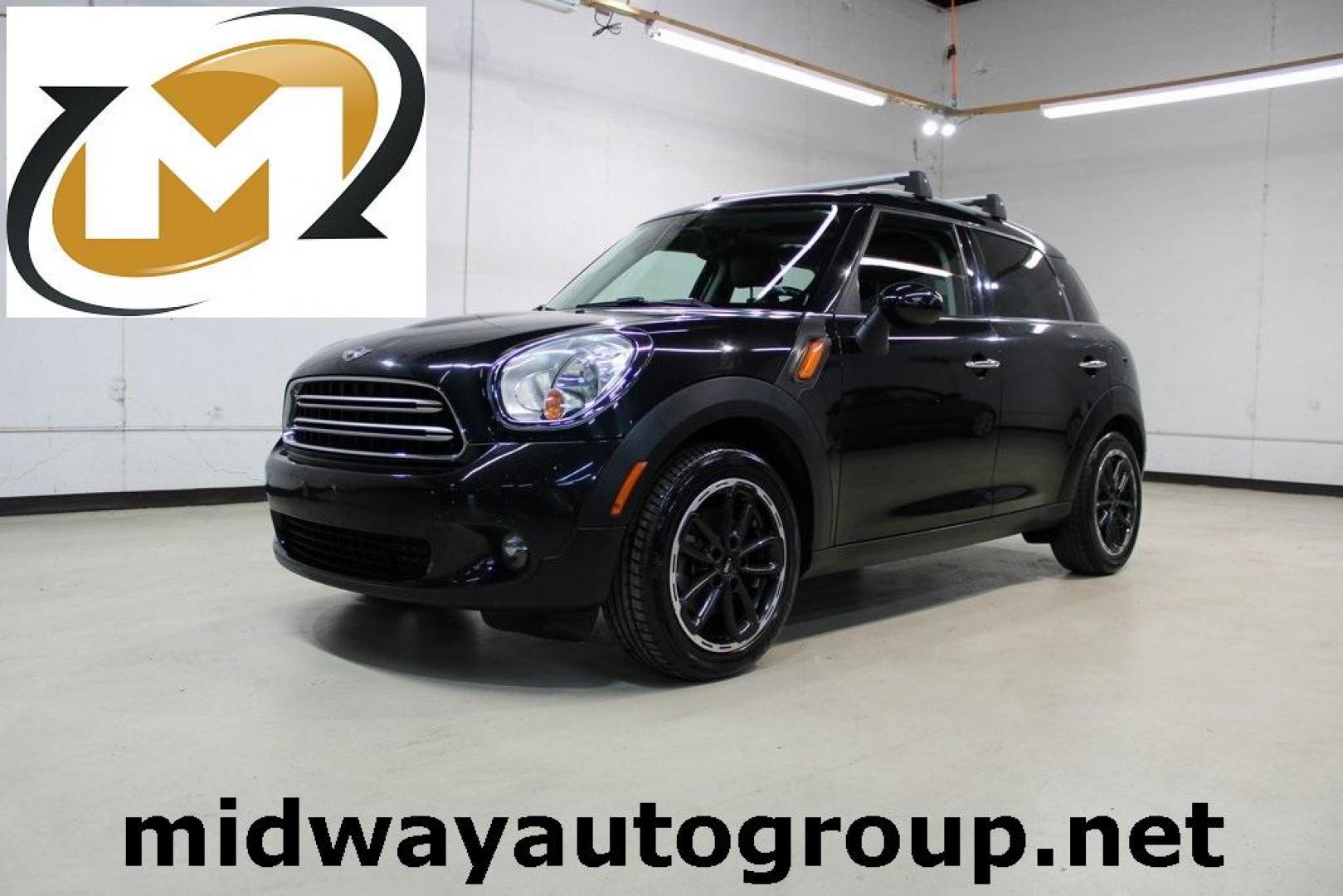 2015 Black Metallic /Carbon Black MINI Cooper Countryman Base (WMWZB3C55FW) with an 1.6L I4 DOHC 16V engine, Manual transmission, located at 15300 Midway Rd., Addison, TX, 75001, (972) 702-0011, 32.958321, -96.838074 - Photo#0