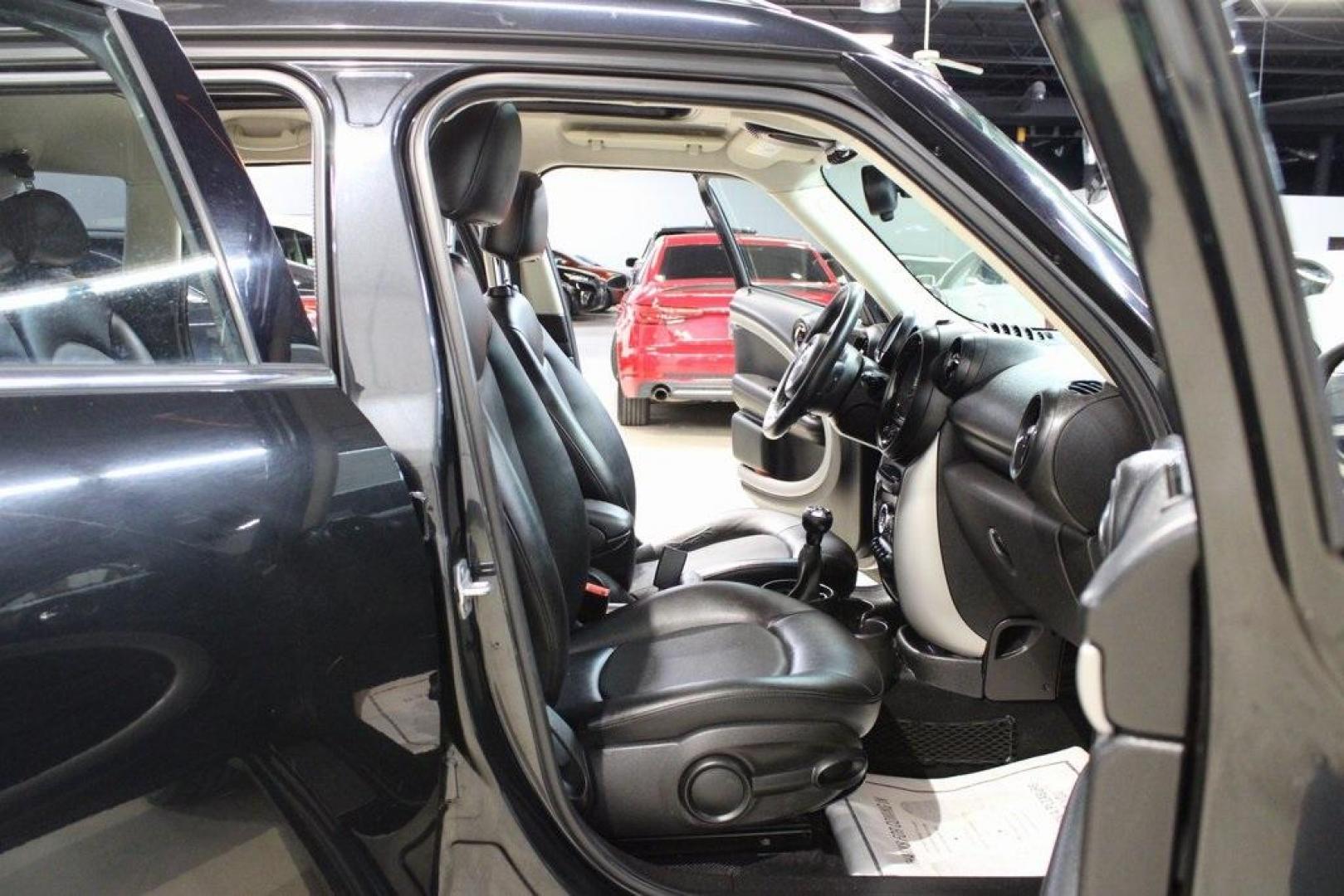 2015 Black Metallic /Carbon Black MINI Cooper Countryman Base (WMWZB3C55FW) with an 1.6L I4 DOHC 16V engine, Manual transmission, located at 15300 Midway Rd., Addison, TX, 75001, (972) 702-0011, 32.958321, -96.838074 - Photo#14