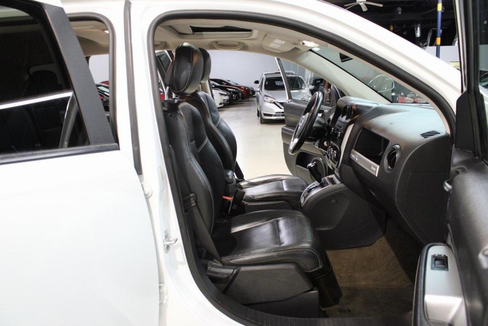 2017 Bright White Clearcoat /Gray Jeep Compass High Altitude (1C4NJDEB5HD) with an 2.4L I4 DOHC 16V Dual VVT engine, Automatic transmission, located at 15300 Midway Rd., Addison, TX, 75001, (972) 702-0011, 32.958321, -96.838074 - Introducing the 2017 Jeep Compass High Altitude, now available at Midway Auto Group in Addison, Texas. With 66,431 miles on the odometer and priced at $12,950, this compact SUV offers a blend of style, comfort, and capability. <br>Edmunds<br>+6<br>midwayautogroup.net<br>+6<br>AutosToday<br>+6<br><br - Photo#12