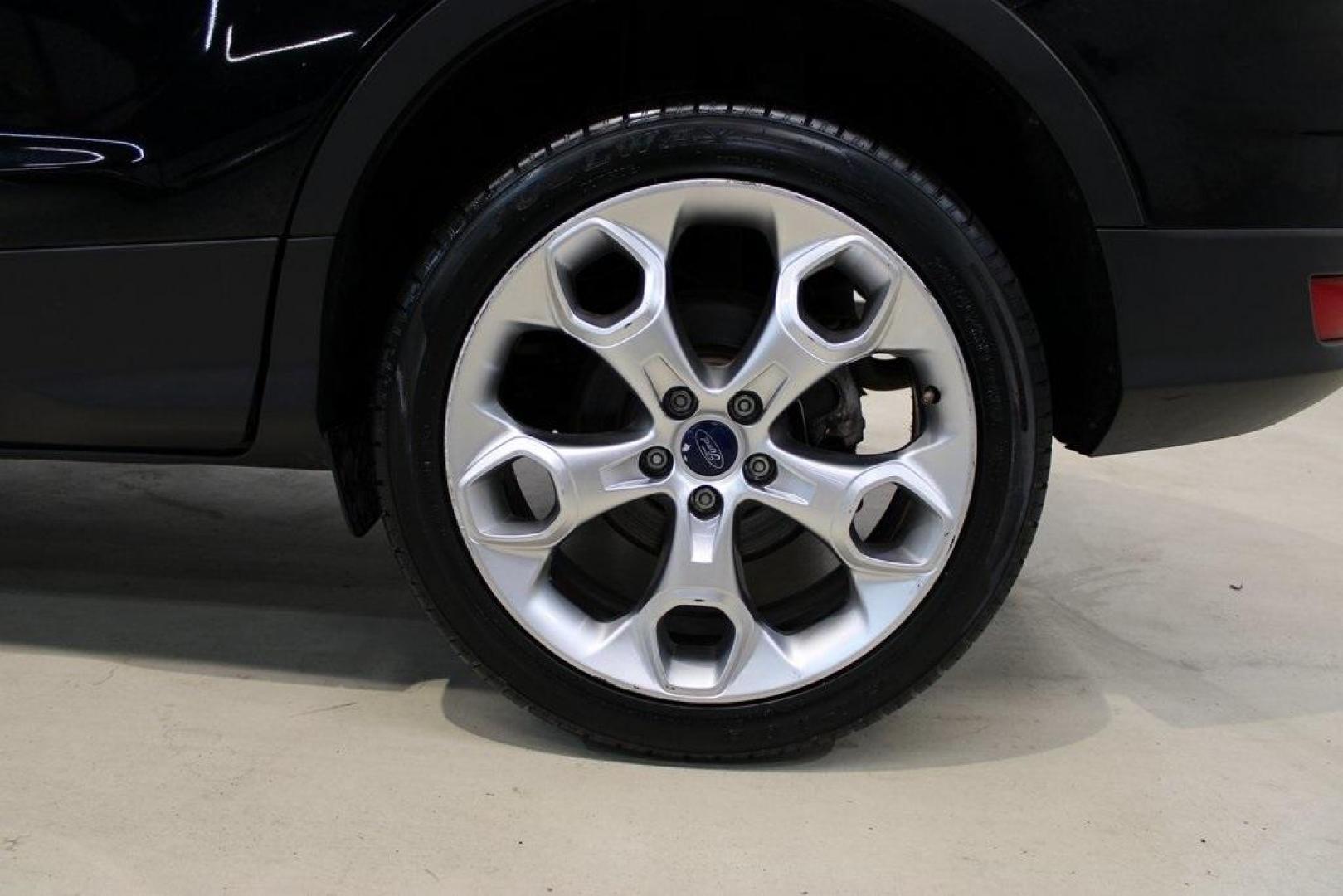2016 Shadow Black /Black Ford Escape Titanium (1FMCU9J91GU) with an EcoBoost 2.0L I4 GTDi DOHC Turbocharged VCT engine, Automatic transmission, located at 15300 Midway Rd., Addison, TX, 75001, (972) 702-0011, 32.958321, -96.838074 - Introducing the 2016 Ford Escape Titanium, now available at Midway Auto Group in Addison, Texas. With 87,065 miles on the odometer and priced at $11,950, this SUV offers a blend of performance, comfort, and advanced features. <br>midwayautogroup.net<br>+2<br>midwayautogroup.net<br>+2<br>Cruz.com<br> - Photo#9