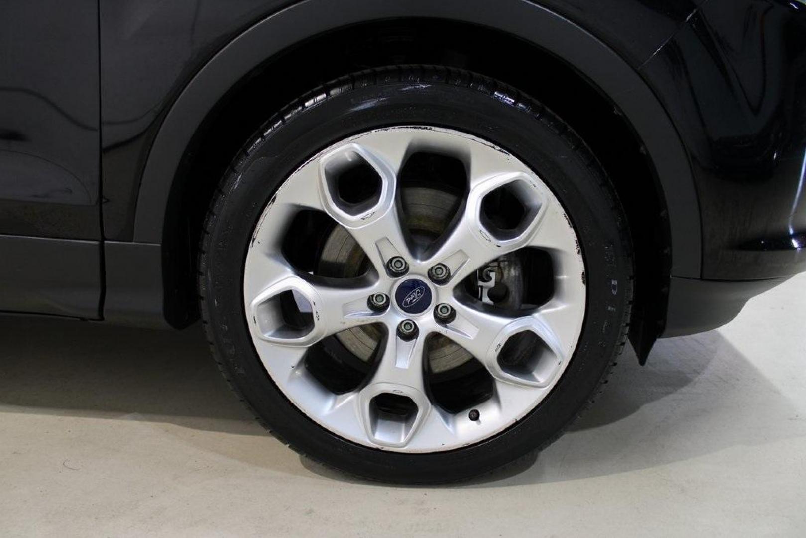 2016 Shadow Black /Black Ford Escape Titanium (1FMCU9J91GU) with an EcoBoost 2.0L I4 GTDi DOHC Turbocharged VCT engine, Automatic transmission, located at 15300 Midway Rd., Addison, TX, 75001, (972) 702-0011, 32.958321, -96.838074 - Introducing the 2016 Ford Escape Titanium, now available at Midway Auto Group in Addison, Texas. With 87,065 miles on the odometer and priced at $11,950, this SUV offers a blend of performance, comfort, and advanced features. <br>midwayautogroup.net<br>+2<br>midwayautogroup.net<br>+2<br>Cruz.com<br> - Photo#11