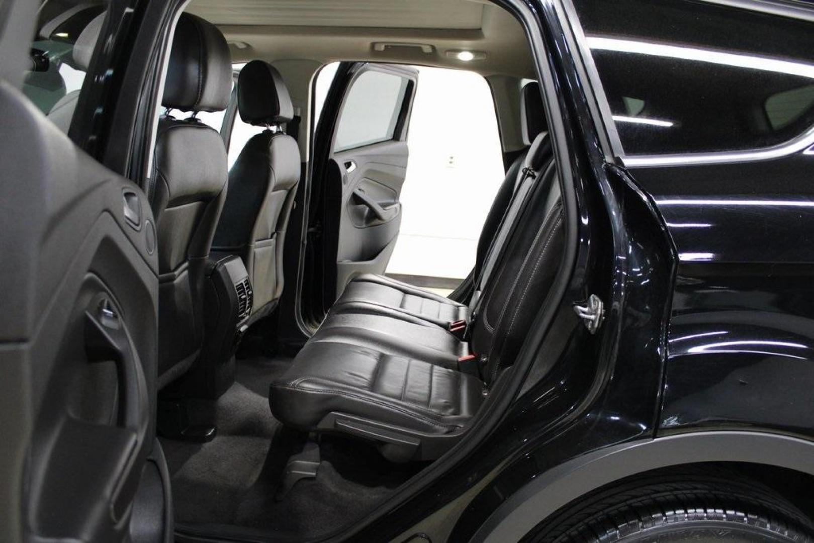 2016 Shadow Black /Black Ford Escape Titanium (1FMCU9J91GU) with an EcoBoost 2.0L I4 GTDi DOHC Turbocharged VCT engine, Automatic transmission, located at 15300 Midway Rd., Addison, TX, 75001, (972) 702-0011, 32.958321, -96.838074 - Introducing the 2016 Ford Escape Titanium, now available at Midway Auto Group in Addison, Texas. With 87,065 miles on the odometer and priced at $11,950, this SUV offers a blend of performance, comfort, and advanced features. <br>midwayautogroup.net<br>+2<br>midwayautogroup.net<br>+2<br>Cruz.com<br> - Photo#16