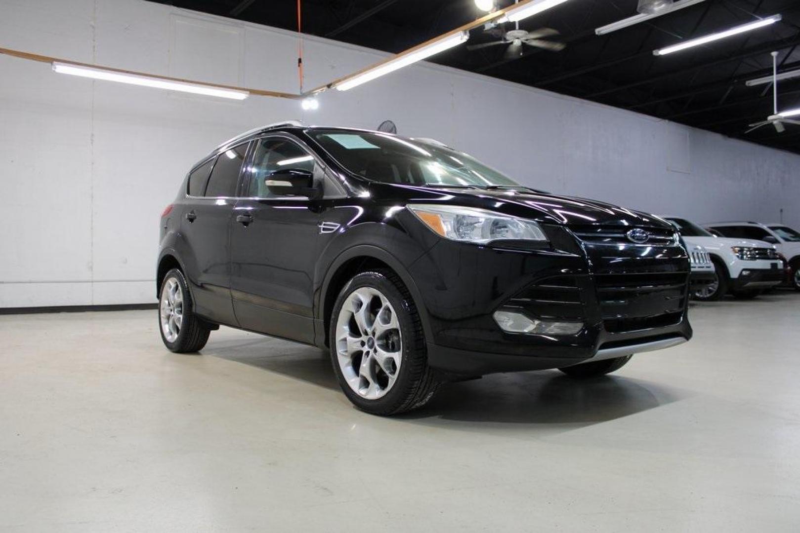 2016 Shadow Black /Black Ford Escape Titanium (1FMCU9J91GU) with an EcoBoost 2.0L I4 GTDi DOHC Turbocharged VCT engine, Automatic transmission, located at 15300 Midway Rd., Addison, TX, 75001, (972) 702-0011, 32.958321, -96.838074 - Introducing the 2016 Ford Escape Titanium, now available at Midway Auto Group in Addison, Texas. With 87,065 miles on the odometer and priced at $11,950, this SUV offers a blend of performance, comfort, and advanced features. <br>midwayautogroup.net<br>+2<br>midwayautogroup.net<br>+2<br>Cruz.com<br> - Photo#1