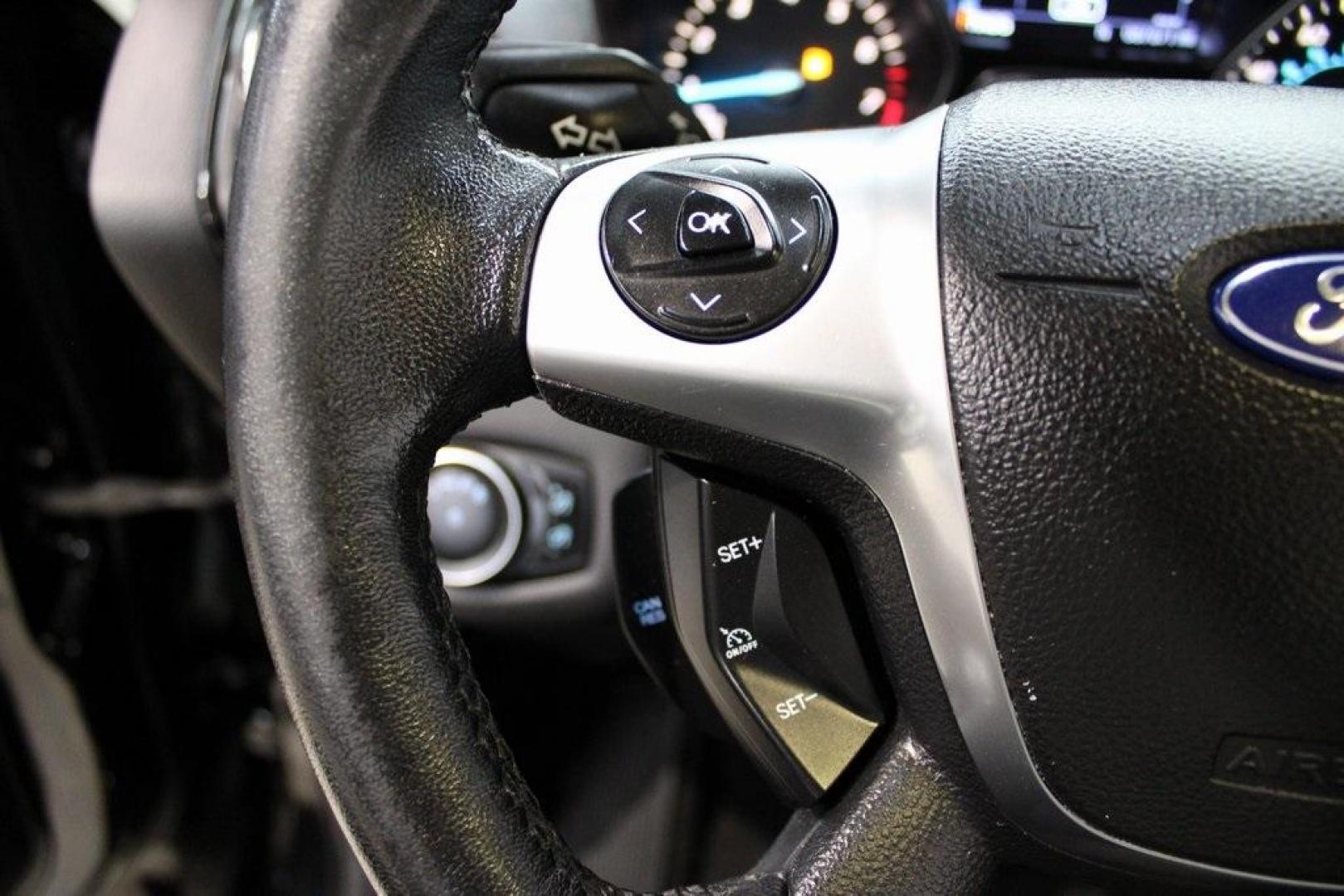 2016 Shadow Black /Black Ford Escape Titanium (1FMCU9J91GU) with an EcoBoost 2.0L I4 GTDi DOHC Turbocharged VCT engine, Automatic transmission, located at 15300 Midway Rd., Addison, TX, 75001, (972) 702-0011, 32.958321, -96.838074 - Introducing the 2016 Ford Escape Titanium, now available at Midway Auto Group in Addison, Texas. With 87,065 miles on the odometer and priced at $11,950, this SUV offers a blend of performance, comfort, and advanced features. <br>midwayautogroup.net<br>+2<br>midwayautogroup.net<br>+2<br>Cruz.com<br> - Photo#26
