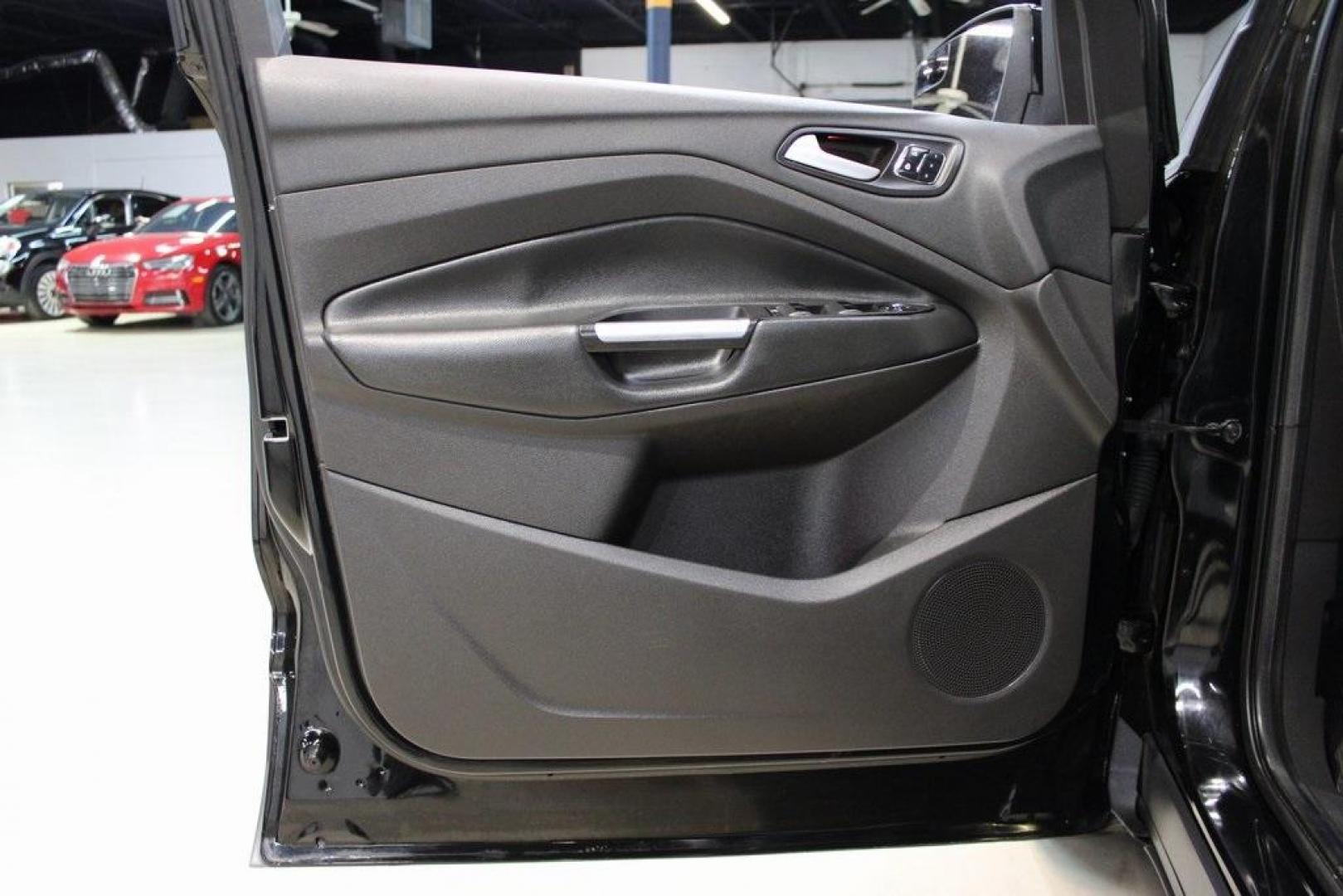 2016 Shadow Black /Black Ford Escape Titanium (1FMCU9J91GU) with an EcoBoost 2.0L I4 GTDi DOHC Turbocharged VCT engine, Automatic transmission, located at 15300 Midway Rd., Addison, TX, 75001, (972) 702-0011, 32.958321, -96.838074 - Introducing the 2016 Ford Escape Titanium, now available at Midway Auto Group in Addison, Texas. With 87,065 miles on the odometer and priced at $11,950, this SUV offers a blend of performance, comfort, and advanced features. <br>midwayautogroup.net<br>+2<br>midwayautogroup.net<br>+2<br>Cruz.com<br> - Photo#28