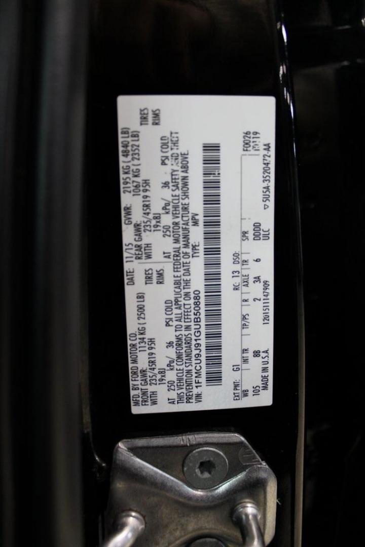 2016 Shadow Black /Black Ford Escape Titanium (1FMCU9J91GU) with an EcoBoost 2.0L I4 GTDi DOHC Turbocharged VCT engine, Automatic transmission, located at 15300 Midway Rd., Addison, TX, 75001, (972) 702-0011, 32.958321, -96.838074 - Introducing the 2016 Ford Escape Titanium, now available at Midway Auto Group in Addison, Texas. With 87,065 miles on the odometer and priced at $11,950, this SUV offers a blend of performance, comfort, and advanced features. <br>midwayautogroup.net<br>+2<br>midwayautogroup.net<br>+2<br>Cruz.com<br> - Photo#32