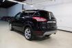 2016 Shadow Black /Black Ford Escape Titanium (1FMCU9J91GU) with an EcoBoost 2.0L I4 GTDi DOHC Turbocharged VCT engine, Automatic transmission, located at 15300 Midway Rd., Addison, TX, 75001, (972) 702-0011, 32.958321, -96.838074 - Introducing the 2016 Ford Escape Titanium, now available at Midway Auto Group in Addison, Texas. With 87,065 miles on the odometer and priced at $11,950, this SUV offers a blend of performance, comfort, and advanced features. <br>midwayautogroup.net<br>+2<br>midwayautogroup.net<br>+2<br>Cruz.com<br> - Photo#3