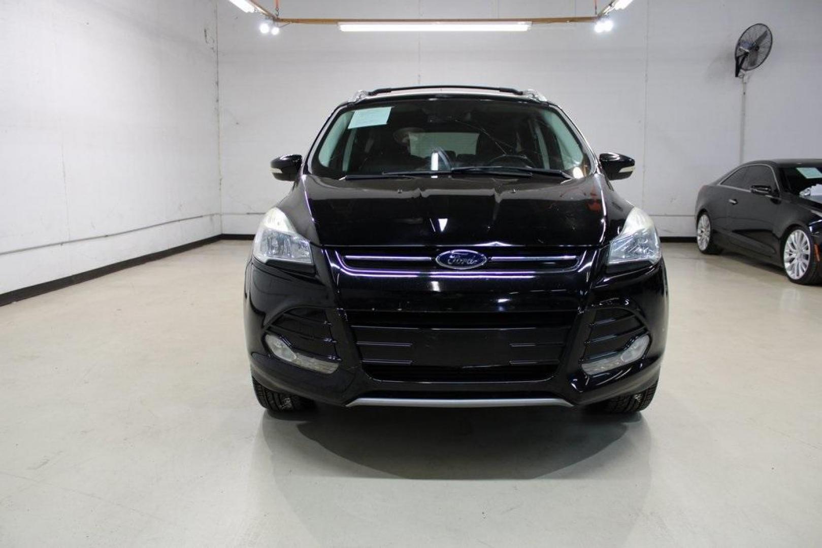 2016 Shadow Black /Black Ford Escape Titanium (1FMCU9J91GU) with an EcoBoost 2.0L I4 GTDi DOHC Turbocharged VCT engine, Automatic transmission, located at 15300 Midway Rd., Addison, TX, 75001, (972) 702-0011, 32.958321, -96.838074 - Introducing the 2016 Ford Escape Titanium, now available at Midway Auto Group in Addison, Texas. With 87,065 miles on the odometer and priced at $11,950, this SUV offers a blend of performance, comfort, and advanced features. <br>midwayautogroup.net<br>+2<br>midwayautogroup.net<br>+2<br>Cruz.com<br> - Photo#5