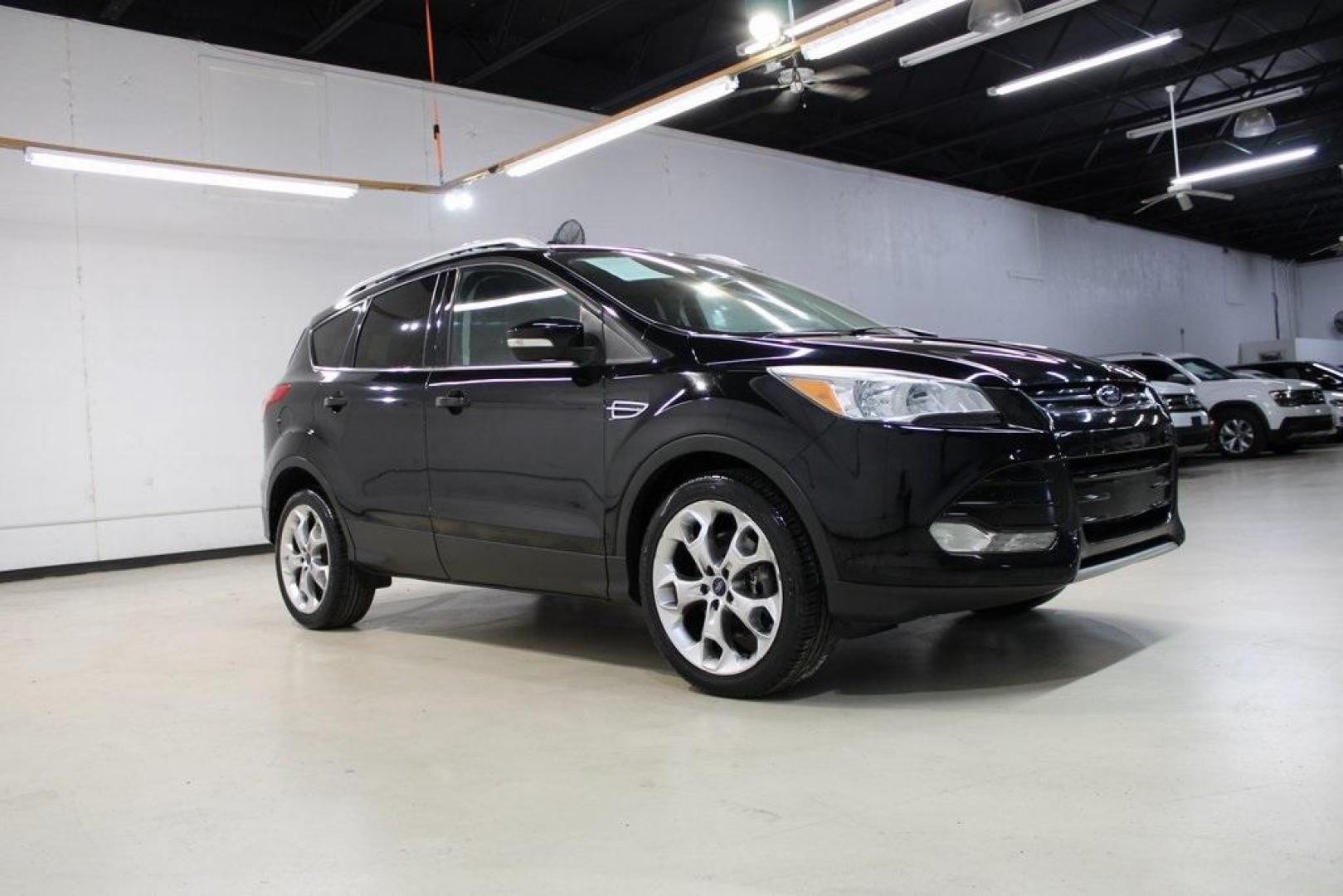 2016 Shadow Black /Black Ford Escape Titanium (1FMCU9J91GU) with an EcoBoost 2.0L I4 GTDi DOHC Turbocharged VCT engine, Automatic transmission, located at 15300 Midway Rd., Addison, TX, 75001, (972) 702-0011, 32.958321, -96.838074 - Introducing the 2016 Ford Escape Titanium, now available at Midway Auto Group in Addison, Texas. With 87,065 miles on the odometer and priced at $11,950, this SUV offers a blend of performance, comfort, and advanced features. <br>midwayautogroup.net<br>+2<br>midwayautogroup.net<br>+2<br>Cruz.com<br> - Photo#6