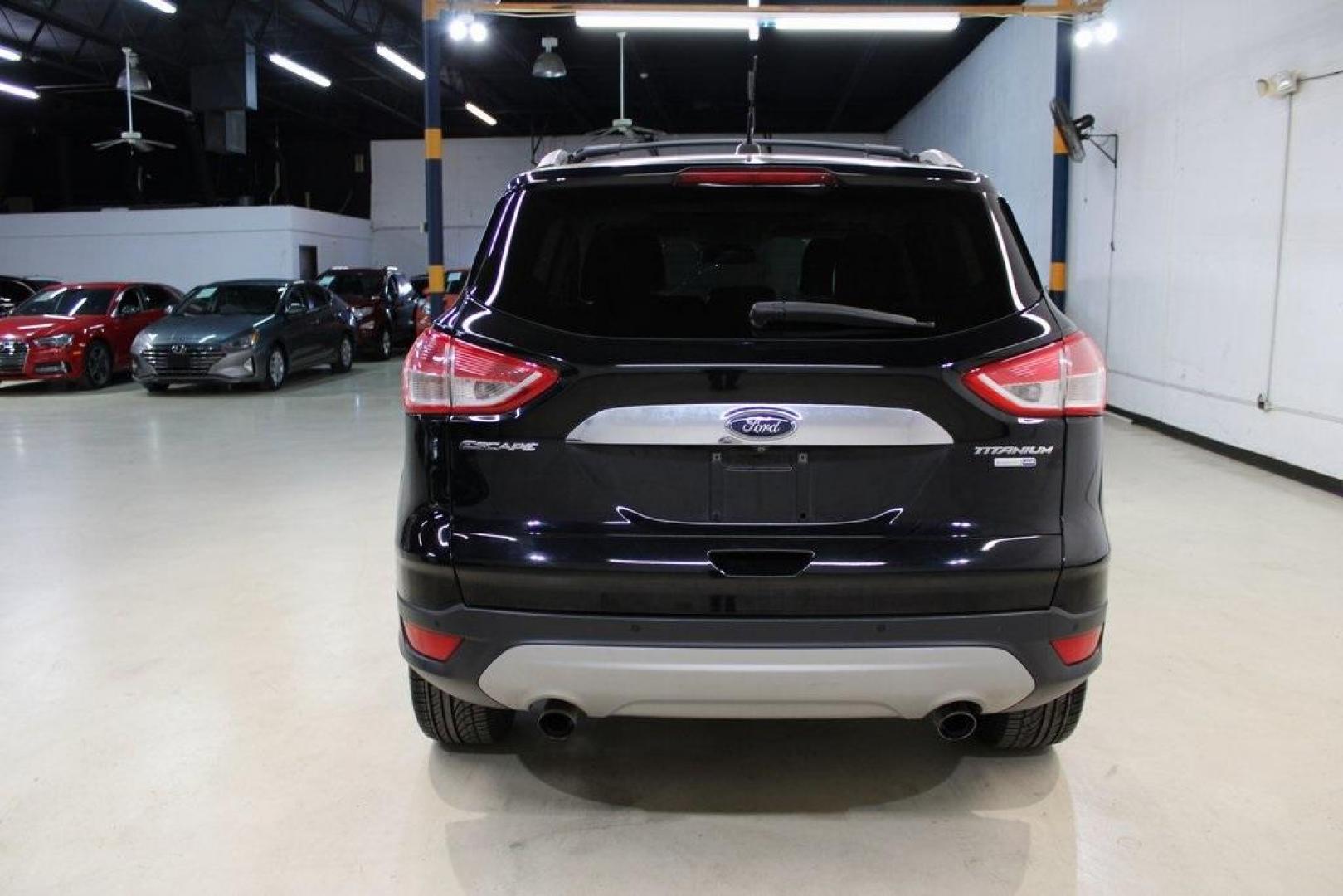 2016 Shadow Black /Black Ford Escape Titanium (1FMCU9J91GU) with an EcoBoost 2.0L I4 GTDi DOHC Turbocharged VCT engine, Automatic transmission, located at 15300 Midway Rd., Addison, TX, 75001, (972) 702-0011, 32.958321, -96.838074 - Introducing the 2016 Ford Escape Titanium, now available at Midway Auto Group in Addison, Texas. With 87,065 miles on the odometer and priced at $11,950, this SUV offers a blend of performance, comfort, and advanced features. <br>midwayautogroup.net<br>+2<br>midwayautogroup.net<br>+2<br>Cruz.com<br> - Photo#7