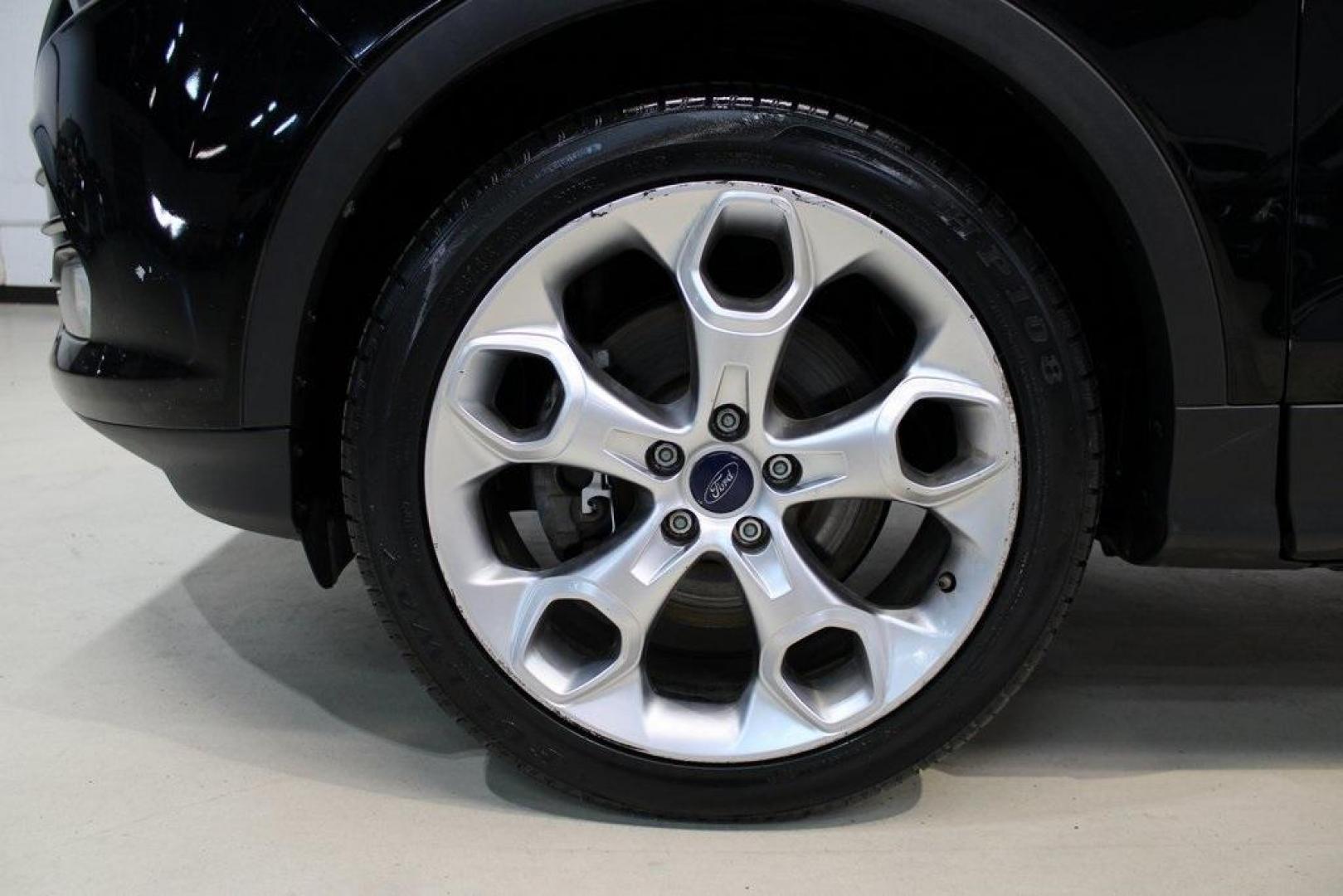 2016 Shadow Black /Black Ford Escape Titanium (1FMCU9J91GU) with an EcoBoost 2.0L I4 GTDi DOHC Turbocharged VCT engine, Automatic transmission, located at 15300 Midway Rd., Addison, TX, 75001, (972) 702-0011, 32.958321, -96.838074 - Introducing the 2016 Ford Escape Titanium, now available at Midway Auto Group in Addison, Texas. With 87,065 miles on the odometer and priced at $11,950, this SUV offers a blend of performance, comfort, and advanced features. <br>midwayautogroup.net<br>+2<br>midwayautogroup.net<br>+2<br>Cruz.com<br> - Photo#8