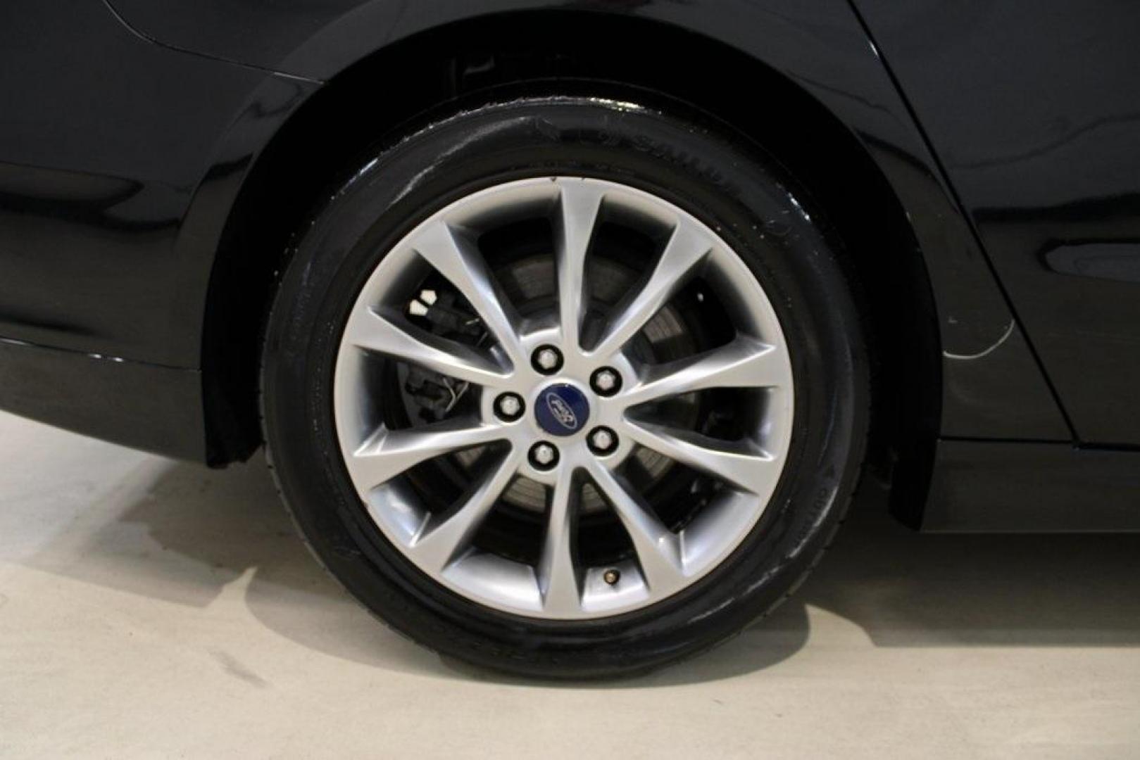 2017 Shadow Black /Ebony Ford Fusion SE (3FA6P0HD6HR) with an 1.5L EcoBoost engine, Automatic transmission, located at 15300 Midway Rd., Addison, TX, 75001, (972) 702-0011, 32.958321, -96.838074 - Stylish, spacious, and built for the road ahead, the 2017 Ford Fusion SE delivers a perfect balance of performance, technology, and comfort. With its sleek design and turbocharged efficiency, this midsize sedan is an outstanding value for anyone looking for a reliable daily driver or a comfortable h - Photo#10