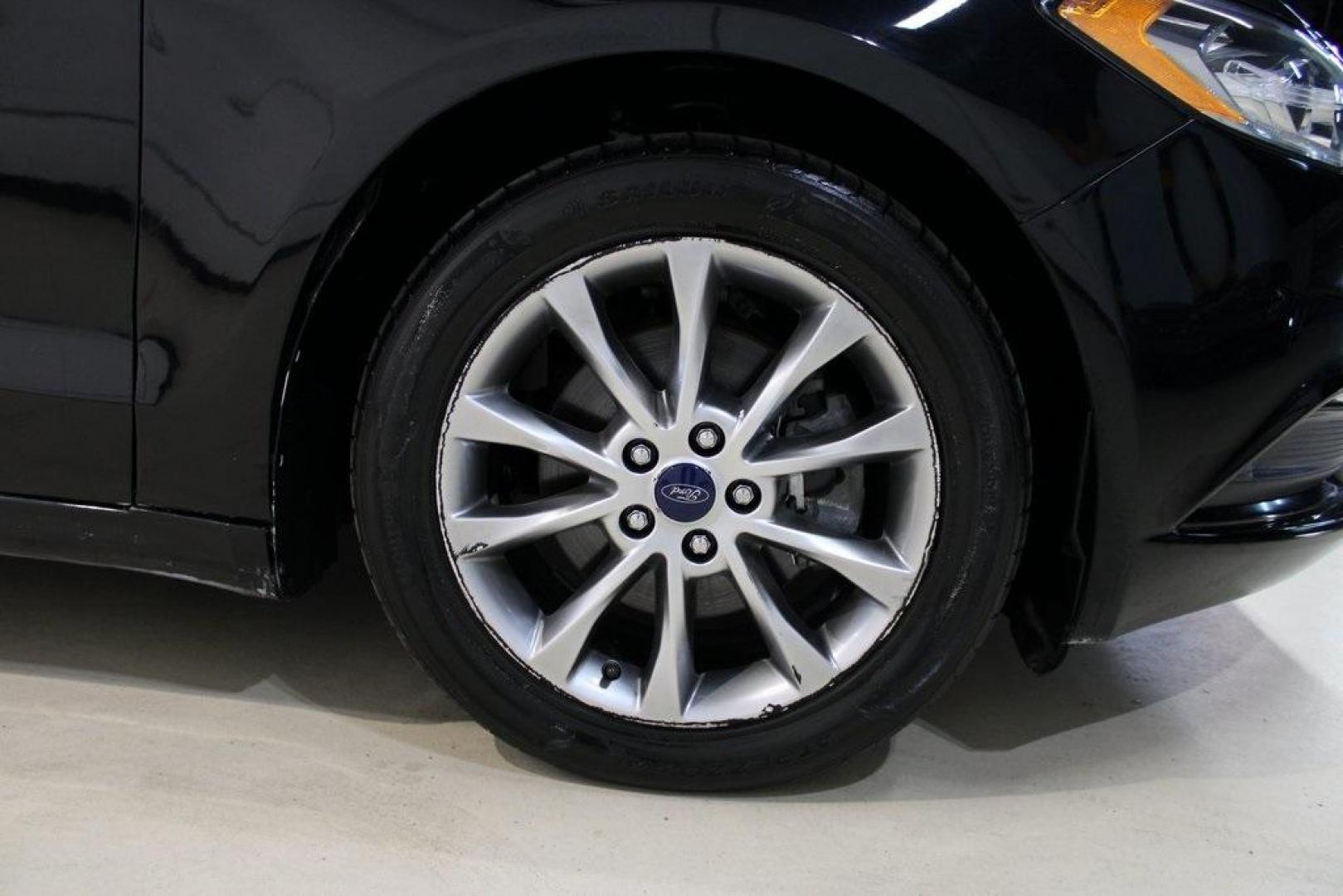 2017 Shadow Black /Ebony Ford Fusion SE (3FA6P0HD6HR) with an 1.5L EcoBoost engine, Automatic transmission, located at 15300 Midway Rd., Addison, TX, 75001, (972) 702-0011, 32.958321, -96.838074 - Stylish, spacious, and built for the road ahead, the 2017 Ford Fusion SE delivers a perfect balance of performance, technology, and comfort. With its sleek design and turbocharged efficiency, this midsize sedan is an outstanding value for anyone looking for a reliable daily driver or a comfortable h - Photo#11