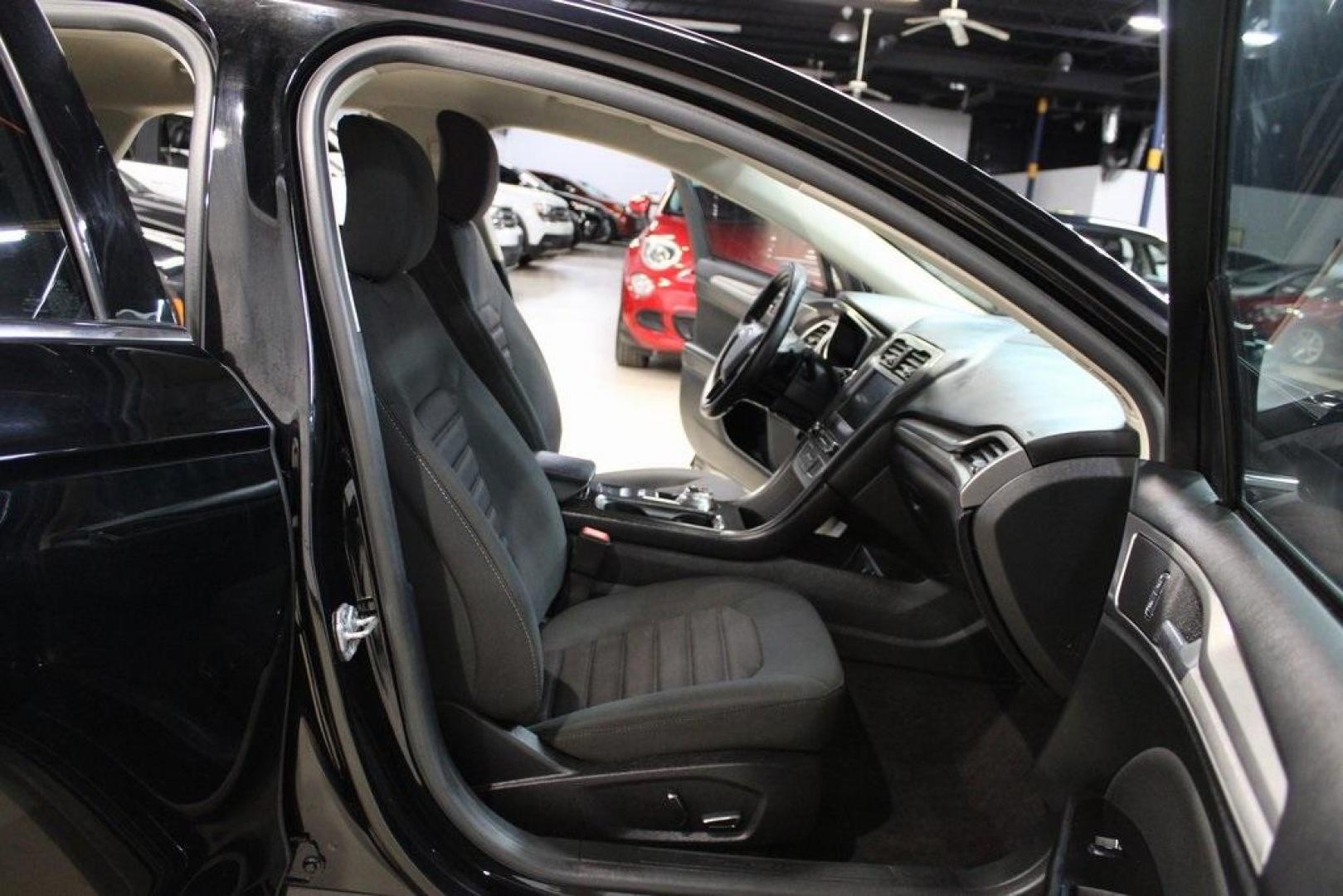 2017 Shadow Black /Ebony Ford Fusion SE (3FA6P0HD6HR) with an 1.5L EcoBoost engine, Automatic transmission, located at 15300 Midway Rd., Addison, TX, 75001, (972) 702-0011, 32.958321, -96.838074 - Stylish, spacious, and built for the road ahead, the 2017 Ford Fusion SE delivers a perfect balance of performance, technology, and comfort. With its sleek design and turbocharged efficiency, this midsize sedan is an outstanding value for anyone looking for a reliable daily driver or a comfortable h - Photo#14