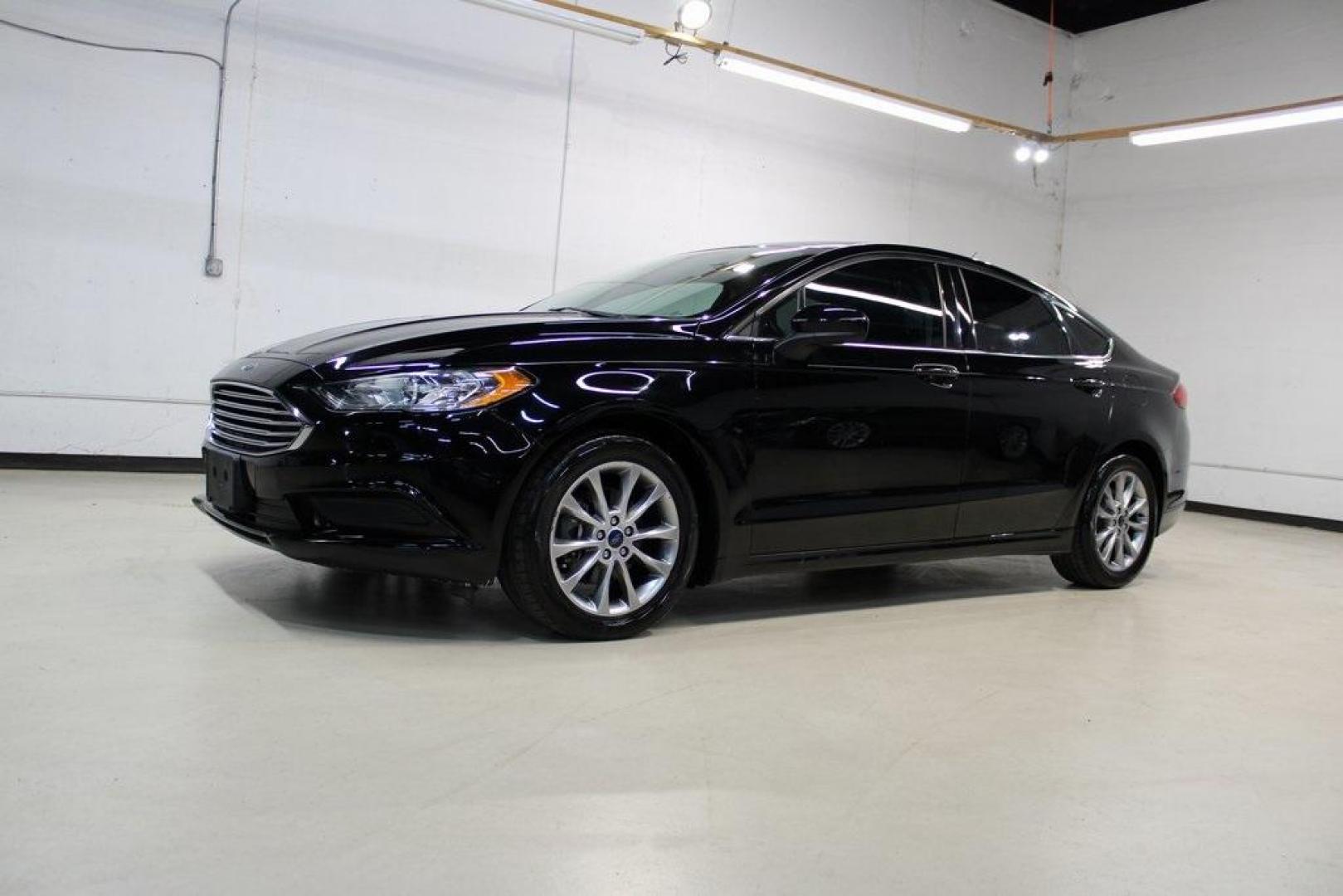 2017 Shadow Black /Ebony Ford Fusion SE (3FA6P0HD6HR) with an 1.5L EcoBoost engine, Automatic transmission, located at 15300 Midway Rd., Addison, TX, 75001, (972) 702-0011, 32.958321, -96.838074 - Stylish, spacious, and built for the road ahead, the 2017 Ford Fusion SE delivers a perfect balance of performance, technology, and comfort. With its sleek design and turbocharged efficiency, this midsize sedan is an outstanding value for anyone looking for a reliable daily driver or a comfortable h - Photo#4