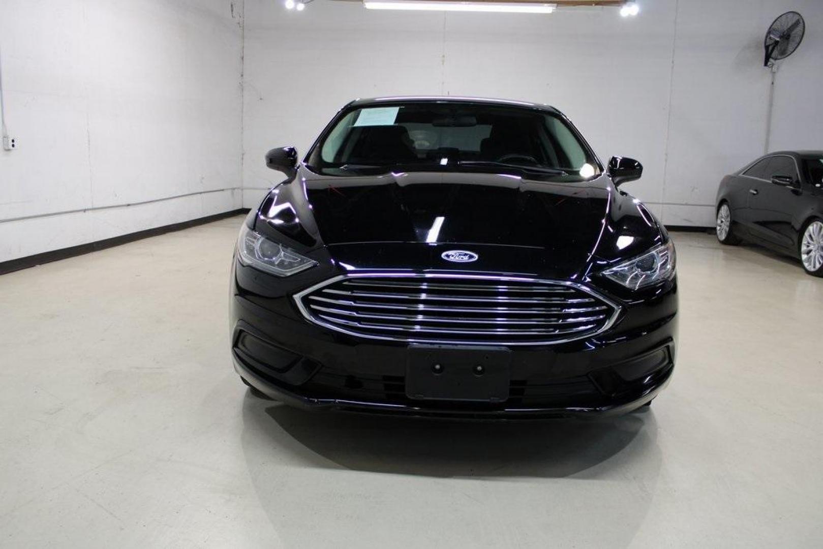 2017 Shadow Black /Ebony Ford Fusion SE (3FA6P0HD6HR) with an 1.5L EcoBoost engine, Automatic transmission, located at 15300 Midway Rd., Addison, TX, 75001, (972) 702-0011, 32.958321, -96.838074 - Stylish, spacious, and built for the road ahead, the 2017 Ford Fusion SE delivers a perfect balance of performance, technology, and comfort. With its sleek design and turbocharged efficiency, this midsize sedan is an outstanding value for anyone looking for a reliable daily driver or a comfortable h - Photo#5