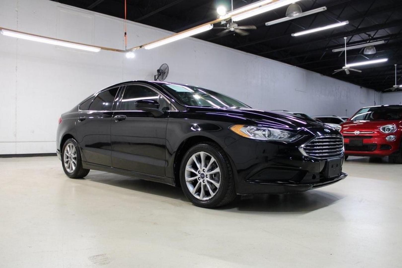 2017 Shadow Black /Ebony Ford Fusion SE (3FA6P0HD6HR) with an 1.5L EcoBoost engine, Automatic transmission, located at 15300 Midway Rd., Addison, TX, 75001, (972) 702-0011, 32.958321, -96.838074 - Stylish, spacious, and built for the road ahead, the 2017 Ford Fusion SE delivers a perfect balance of performance, technology, and comfort. With its sleek design and turbocharged efficiency, this midsize sedan is an outstanding value for anyone looking for a reliable daily driver or a comfortable h - Photo#6