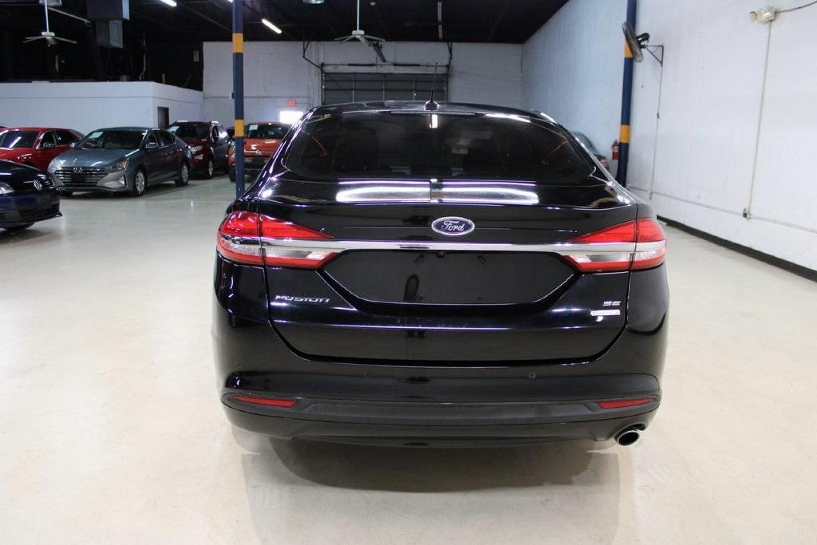 2017 Shadow Black /Ebony Ford Fusion SE (3FA6P0HD6HR) with an 1.5L EcoBoost engine, Automatic transmission, located at 15300 Midway Rd., Addison, TX, 75001, (972) 702-0011, 32.958321, -96.838074 - Stylish, spacious, and built for the road ahead, the 2017 Ford Fusion SE delivers a perfect balance of performance, technology, and comfort. With its sleek design and turbocharged efficiency, this midsize sedan is an outstanding value for anyone looking for a reliable daily driver or a comfortable h - Photo#7