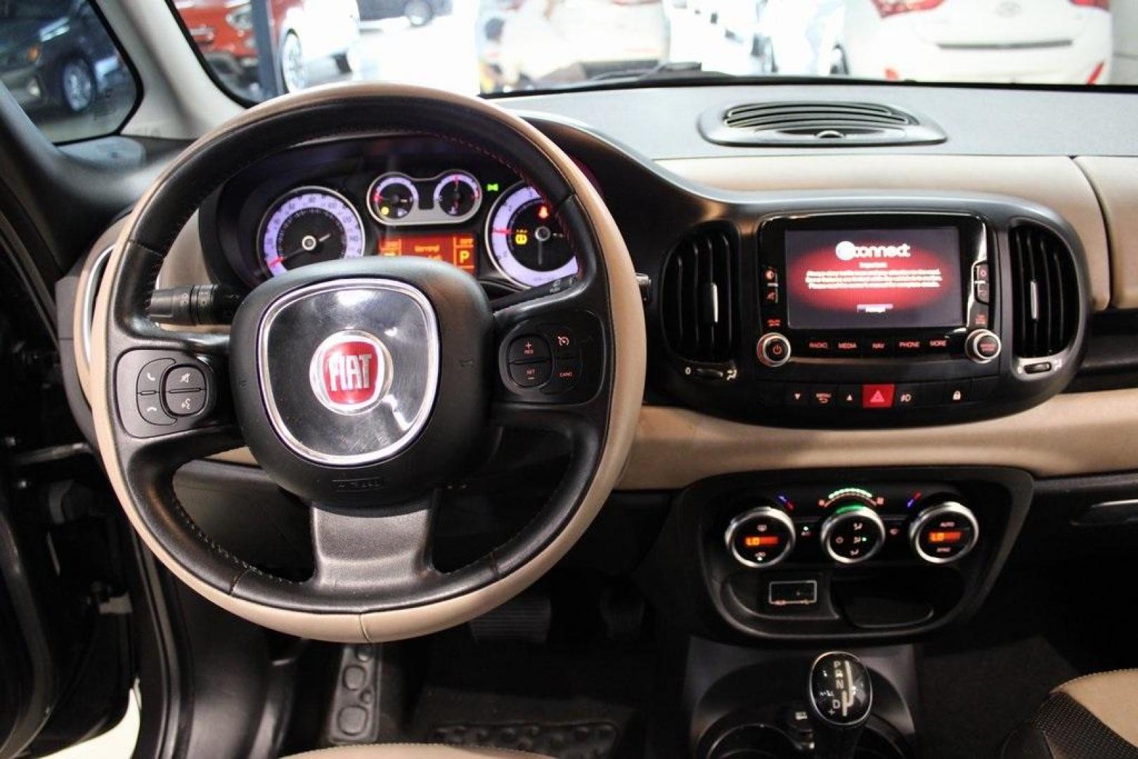 2015 Grigio Scuro (Gray Metallic) /Black Fiat 500L Lounge (ZFBCFACH8FZ) with an 1.4L I4 16V MultiAir Turbocharged engine, Automatic transmission, located at 15300 Midway Rd., Addison, TX, 75001, (972) 702-0011, 32.958321, -96.838074 - Introducing the 2015 Fiat 500L, now available at Midway Auto Group in Addison, Texas. This compact yet spacious vehicle offers a unique blend of Italian design and practicality, making it an excellent choice for those seeking style and versatility.<br>VinInspect<br><br>Key Features:<br><br>Engine: 1 - Photo#13