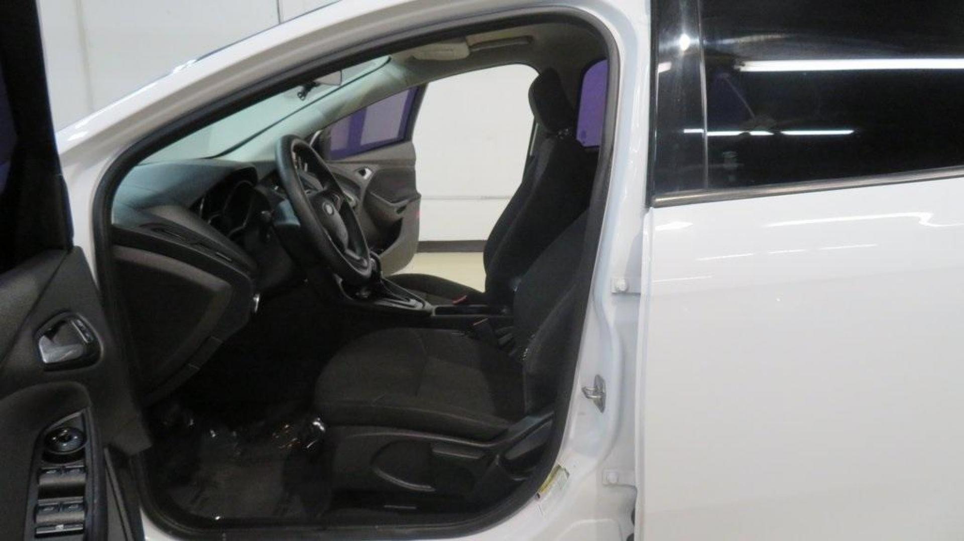 2017 Oxford White /Charcoal Black Ford Focus SE (1FADP3K2XHL) with an 2.0L 4-Cylinder DGI Flex Fuel DOHC engine, Automatic transmission, located at 15300 Midway Rd., Addison, TX, 75001, (972) 702-0011, 32.958321, -96.838074 - Introducing the 2017 Ford Focus SE Hatchback, now available at Midway Auto Group in Addison, Texas. This versatile and stylish compact car is designed to meet the needs of both city driving and weekend adventures.<br><br>Key Features:<br><br>Engine: 2.0L Ti-VCT I-4<br><br>Transmission: 6-speed autom - Photo#12
