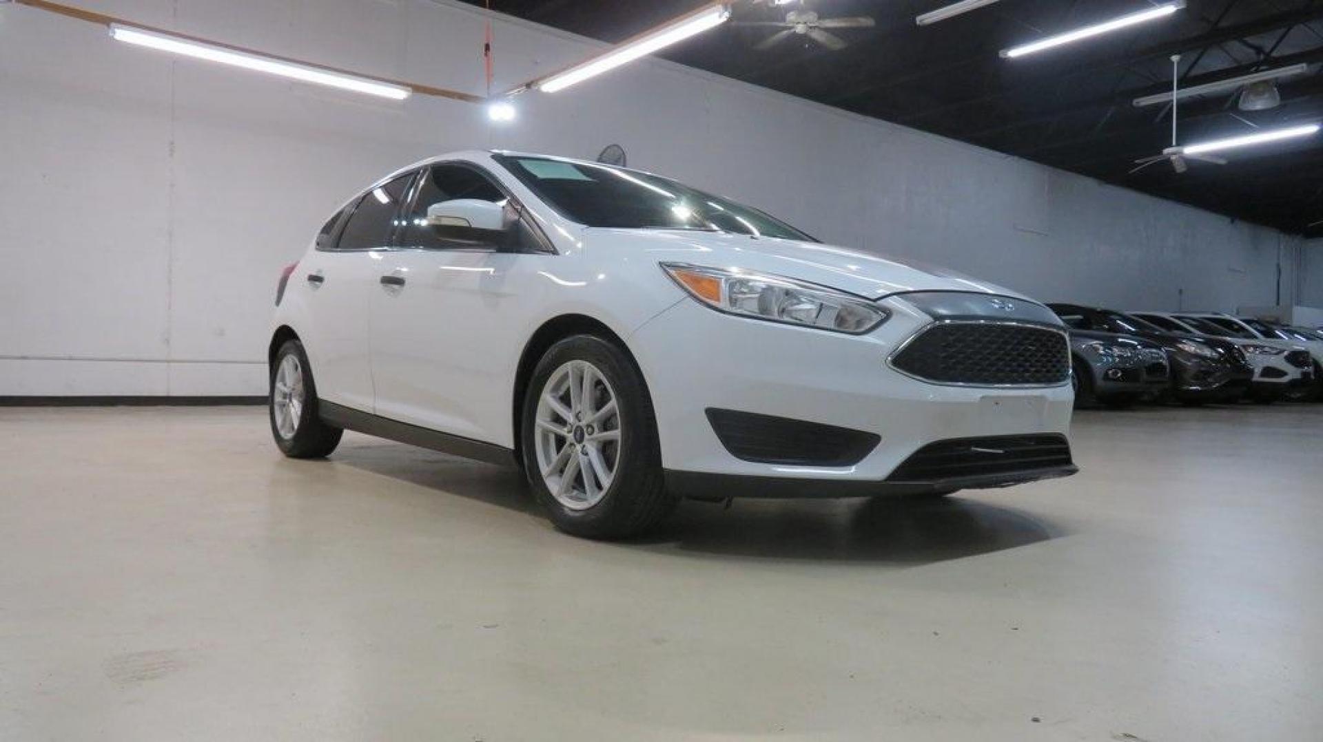 2017 Oxford White /Charcoal Black Ford Focus SE (1FADP3K2XHL) with an 2.0L 4-Cylinder DGI Flex Fuel DOHC engine, Automatic transmission, located at 15300 Midway Rd., Addison, TX, 75001, (972) 702-0011, 32.958321, -96.838074 - Introducing the 2017 Ford Focus SE Hatchback, now available at Midway Auto Group in Addison, Texas. This versatile and stylish compact car is designed to meet the needs of both city driving and weekend adventures.<br><br>Key Features:<br><br>Engine: 2.0L Ti-VCT I-4<br><br>Transmission: 6-speed autom - Photo#1