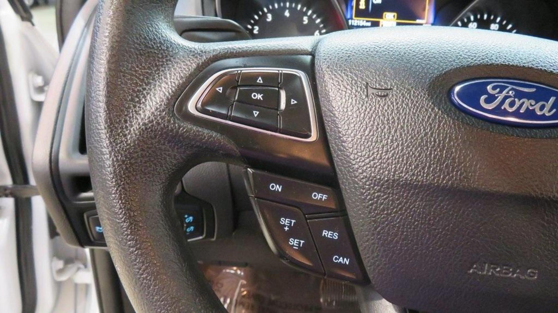 2017 Oxford White /Charcoal Black Ford Focus SE (1FADP3K2XHL) with an 2.0L 4-Cylinder DGI Flex Fuel DOHC engine, Automatic transmission, located at 15300 Midway Rd., Addison, TX, 75001, (972) 702-0011, 32.958321, -96.838074 - Introducing the 2017 Ford Focus SE Hatchback, now available at Midway Auto Group in Addison, Texas. This versatile and stylish compact car is designed to meet the needs of both city driving and weekend adventures.<br><br>Key Features:<br><br>Engine: 2.0L Ti-VCT I-4<br><br>Transmission: 6-speed autom - Photo#21