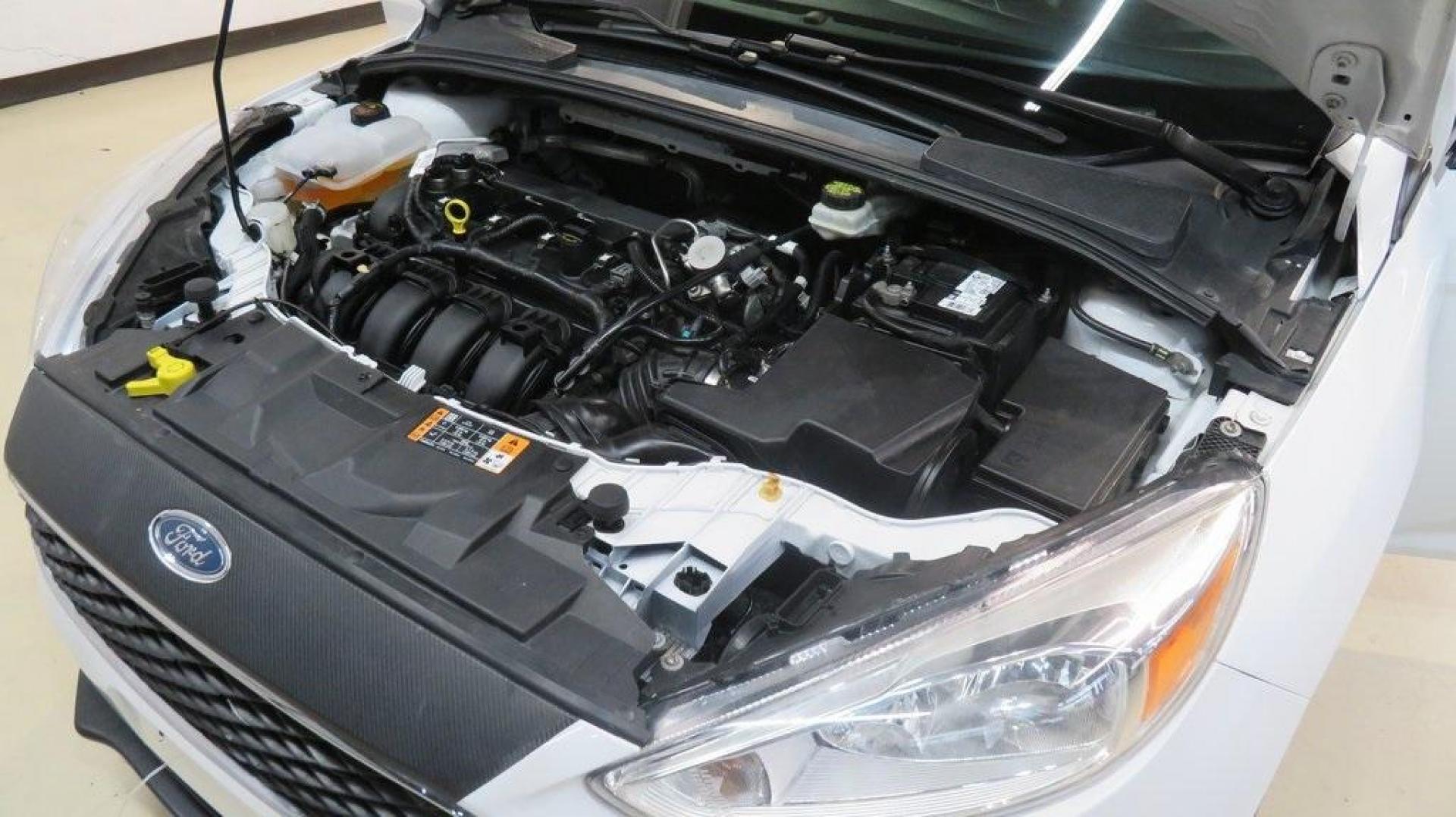 2017 Oxford White /Charcoal Black Ford Focus SE (1FADP3K2XHL) with an 2.0L 4-Cylinder DGI Flex Fuel DOHC engine, Automatic transmission, located at 15300 Midway Rd., Addison, TX, 75001, (972) 702-0011, 32.958321, -96.838074 - Introducing the 2017 Ford Focus SE Hatchback, now available at Midway Auto Group in Addison, Texas. This versatile and stylish compact car is designed to meet the needs of both city driving and weekend adventures.<br><br>Key Features:<br><br>Engine: 2.0L Ti-VCT I-4<br><br>Transmission: 6-speed autom - Photo#26
