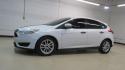 2017 Oxford White /Charcoal Black Ford Focus SE (1FADP3K2XHL) with an 2.0L 4-Cylinder DGI Flex Fuel DOHC engine, Automatic transmission, located at 15300 Midway Rd., Addison, TX, 75001, (972) 702-0011, 32.958321, -96.838074 - Introducing the 2017 Ford Focus SE Hatchback, now available at Midway Auto Group in Addison, Texas. This versatile and stylish compact car is designed to meet the needs of both city driving and weekend adventures.<br><br>Key Features:<br><br>Engine: 2.0L Ti-VCT I-4<br><br>Transmission: 6-speed autom - Photo#4