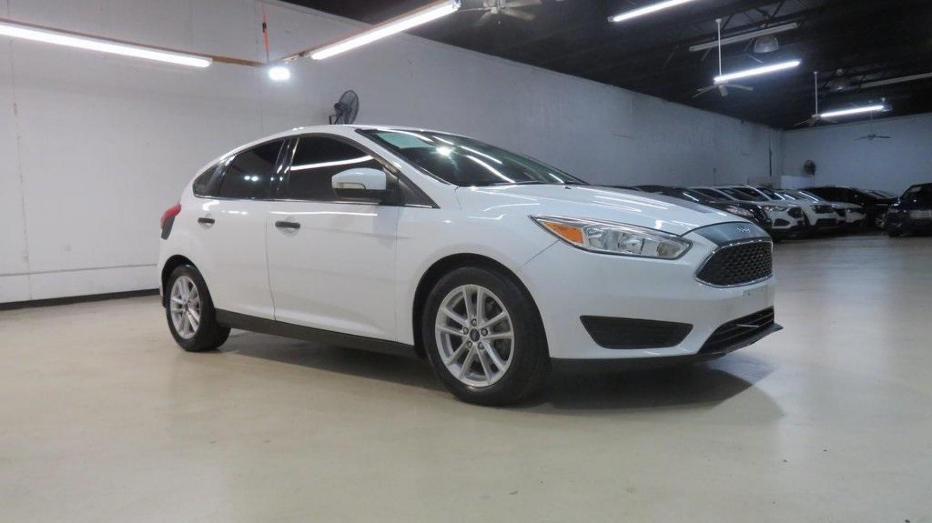 2017 Oxford White /Charcoal Black Ford Focus SE (1FADP3K2XHL) with an 2.0L 4-Cylinder DGI Flex Fuel DOHC engine, Automatic transmission, located at 15300 Midway Rd., Addison, TX, 75001, (972) 702-0011, 32.958321, -96.838074 - Introducing the 2017 Ford Focus SE Hatchback, now available at Midway Auto Group in Addison, Texas. This versatile and stylish compact car is designed to meet the needs of both city driving and weekend adventures.<br><br>Key Features:<br><br>Engine: 2.0L Ti-VCT I-4<br><br>Transmission: 6-speed autom - Photo#6