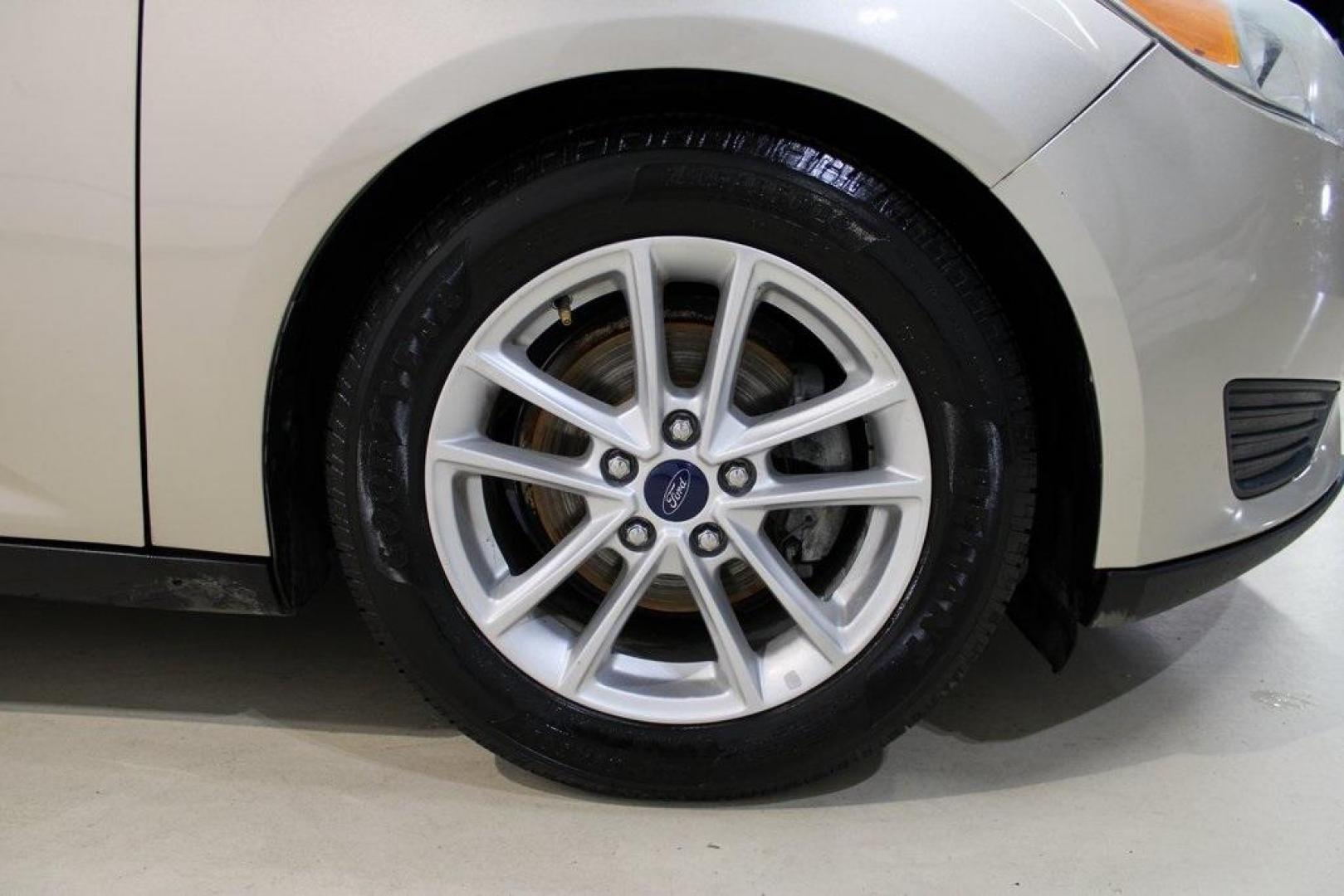 2017 White Gold /Charcoal Black Ford Focus SE (1FADP3F20HL) with an 2.0L 4-Cylinder DGI Flex Fuel Turbocharged DOHC engine, Automatic transmission, located at 15300 Midway Rd., Addison, TX, 75001, (972) 702-0011, 32.958321, -96.838074 - Smart, efficient, and built for everyday life, the 2017 Ford Focus SE offers a dependable and comfortable ride with modern tech and a stylish exterior. Whether you're a commuter or a student, this compact sedan checks all the boxes for affordability, fuel efficiency, and convenience.<br><br>Key Spec - Photo#9