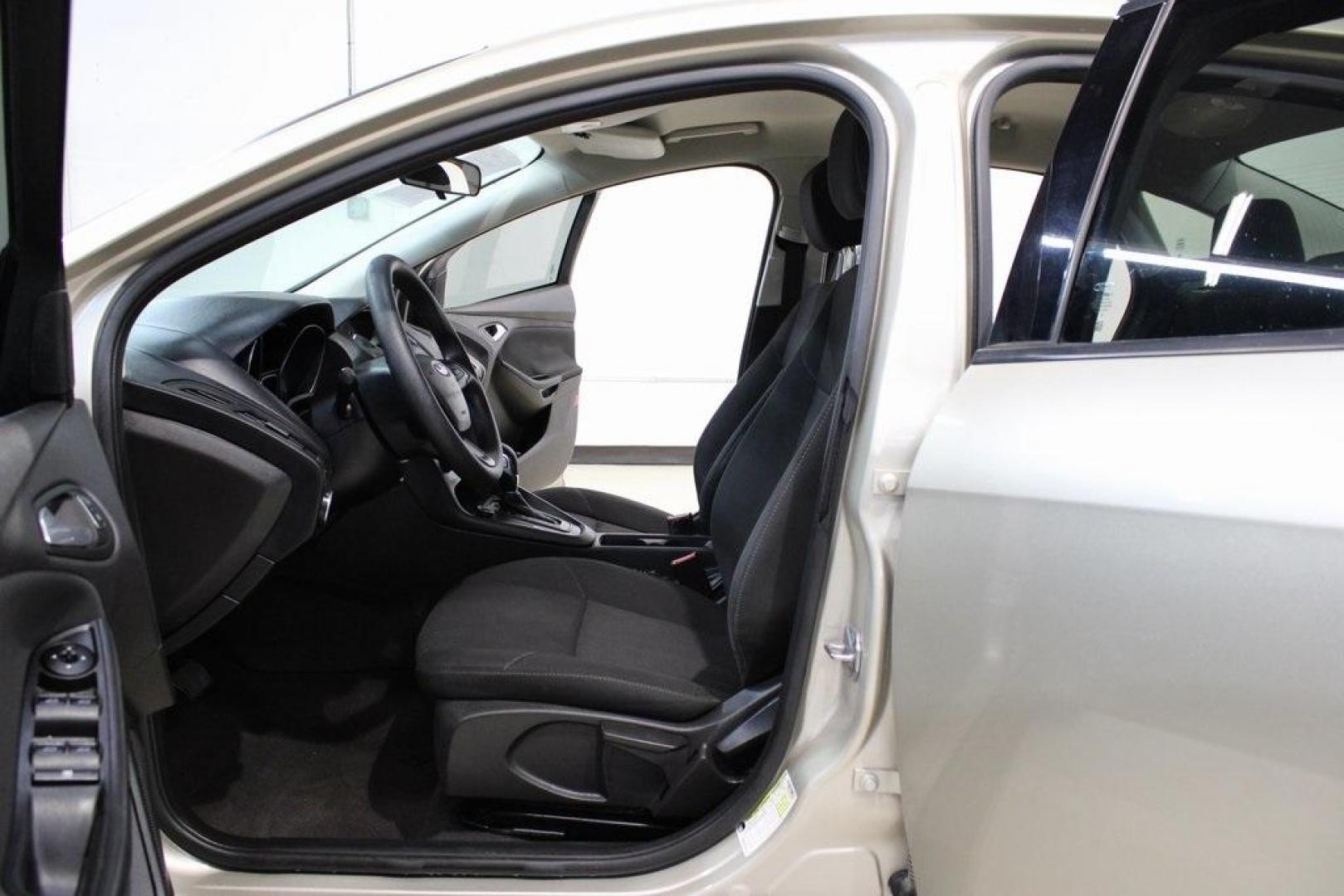 2017 White Gold /Charcoal Black Ford Focus SE (1FADP3F20HL) with an 2.0L 4-Cylinder DGI Flex Fuel Turbocharged DOHC engine, Automatic transmission, located at 15300 Midway Rd., Addison, TX, 75001, (972) 702-0011, 32.958321, -96.838074 - Smart, efficient, and built for everyday life, the 2017 Ford Focus SE offers a dependable and comfortable ride with modern tech and a stylish exterior. Whether you're a commuter or a student, this compact sedan checks all the boxes for affordability, fuel efficiency, and convenience.<br><br>Key Spec - Photo#11