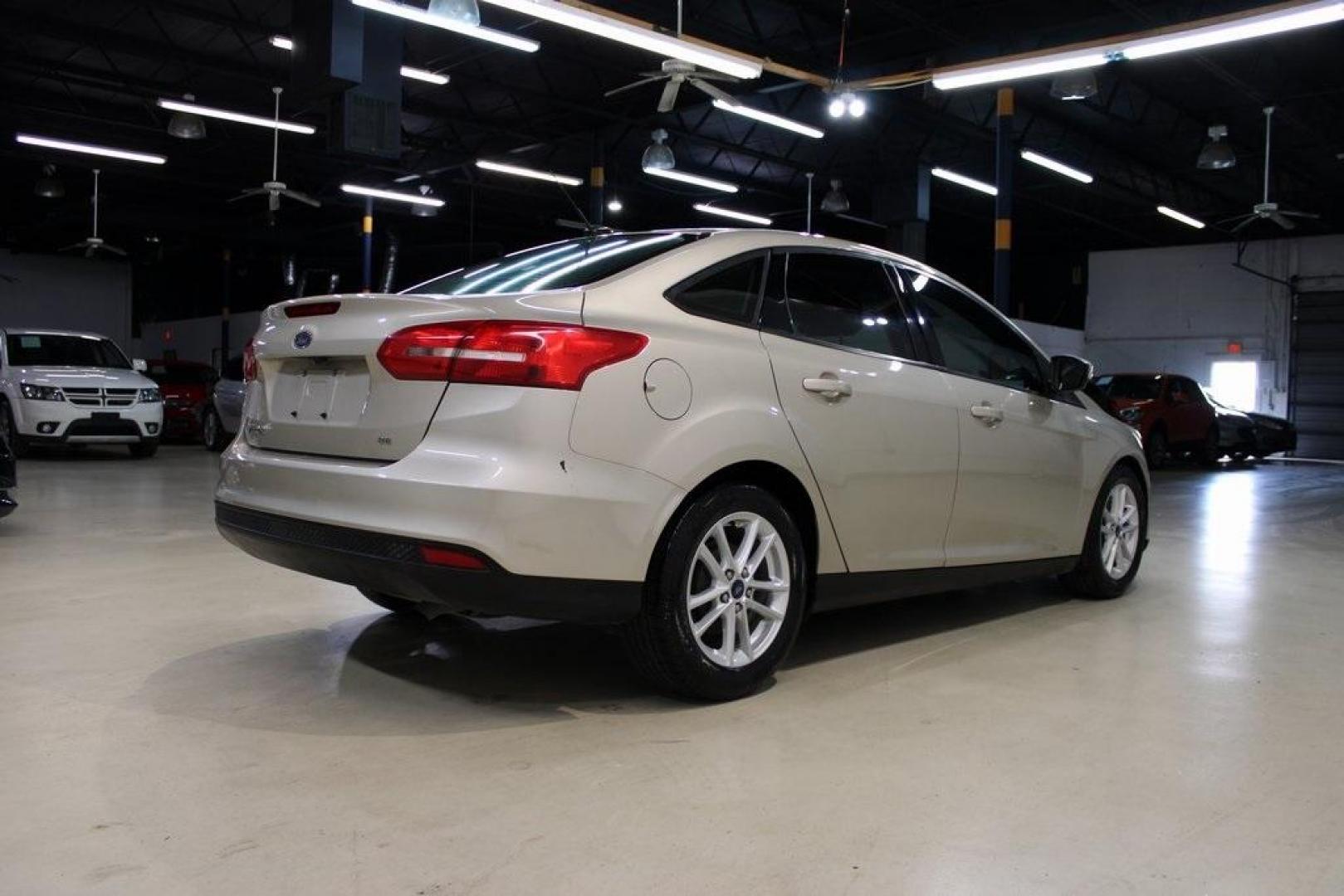 2017 White Gold /Charcoal Black Ford Focus SE (1FADP3F20HL) with an 2.0L 4-Cylinder DGI Flex Fuel Turbocharged DOHC engine, Automatic transmission, located at 15300 Midway Rd., Addison, TX, 75001, (972) 702-0011, 32.958321, -96.838074 - Smart, efficient, and built for everyday life, the 2017 Ford Focus SE offers a dependable and comfortable ride with modern tech and a stylish exterior. Whether you're a commuter or a student, this compact sedan checks all the boxes for affordability, fuel efficiency, and convenience.<br><br>Key Spec - Photo#1