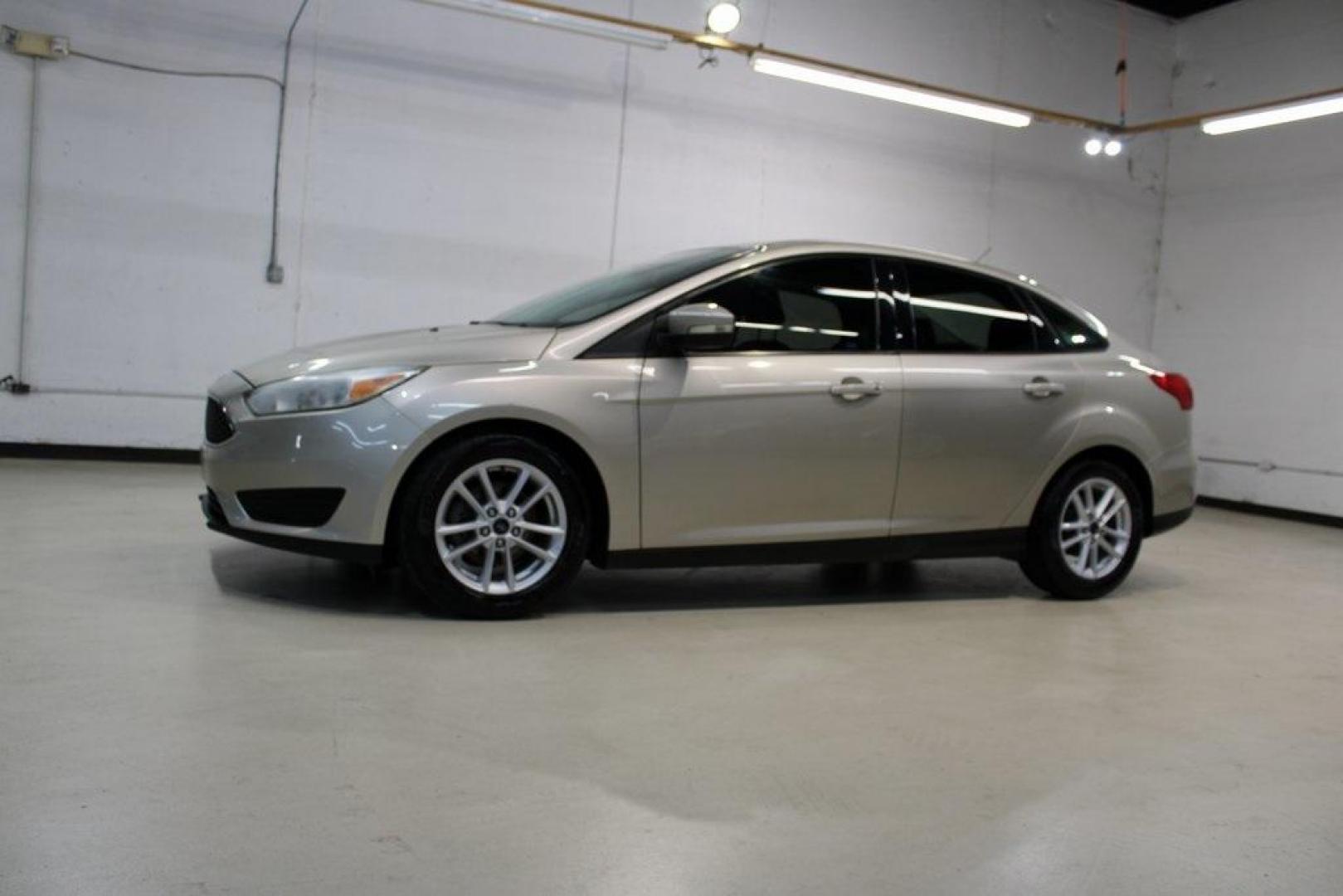 2017 White Gold /Charcoal Black Ford Focus SE (1FADP3F20HL) with an 2.0L 4-Cylinder DGI Flex Fuel Turbocharged DOHC engine, Automatic transmission, located at 15300 Midway Rd., Addison, TX, 75001, (972) 702-0011, 32.958321, -96.838074 - Smart, efficient, and built for everyday life, the 2017 Ford Focus SE offers a dependable and comfortable ride with modern tech and a stylish exterior. Whether you're a commuter or a student, this compact sedan checks all the boxes for affordability, fuel efficiency, and convenience.<br><br>Key Spec - Photo#2