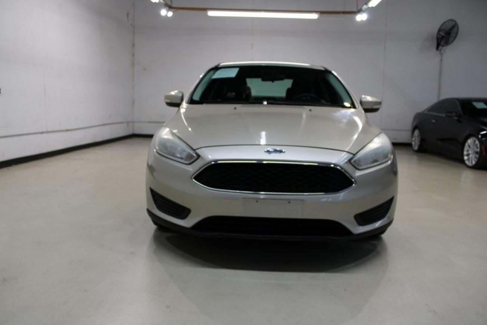 2017 White Gold /Charcoal Black Ford Focus SE (1FADP3F20HL) with an 2.0L 4-Cylinder DGI Flex Fuel Turbocharged DOHC engine, Automatic transmission, located at 15300 Midway Rd., Addison, TX, 75001, (972) 702-0011, 32.958321, -96.838074 - Smart, efficient, and built for everyday life, the 2017 Ford Focus SE offers a dependable and comfortable ride with modern tech and a stylish exterior. Whether you're a commuter or a student, this compact sedan checks all the boxes for affordability, fuel efficiency, and convenience.<br><br>Key Spec - Photo#3