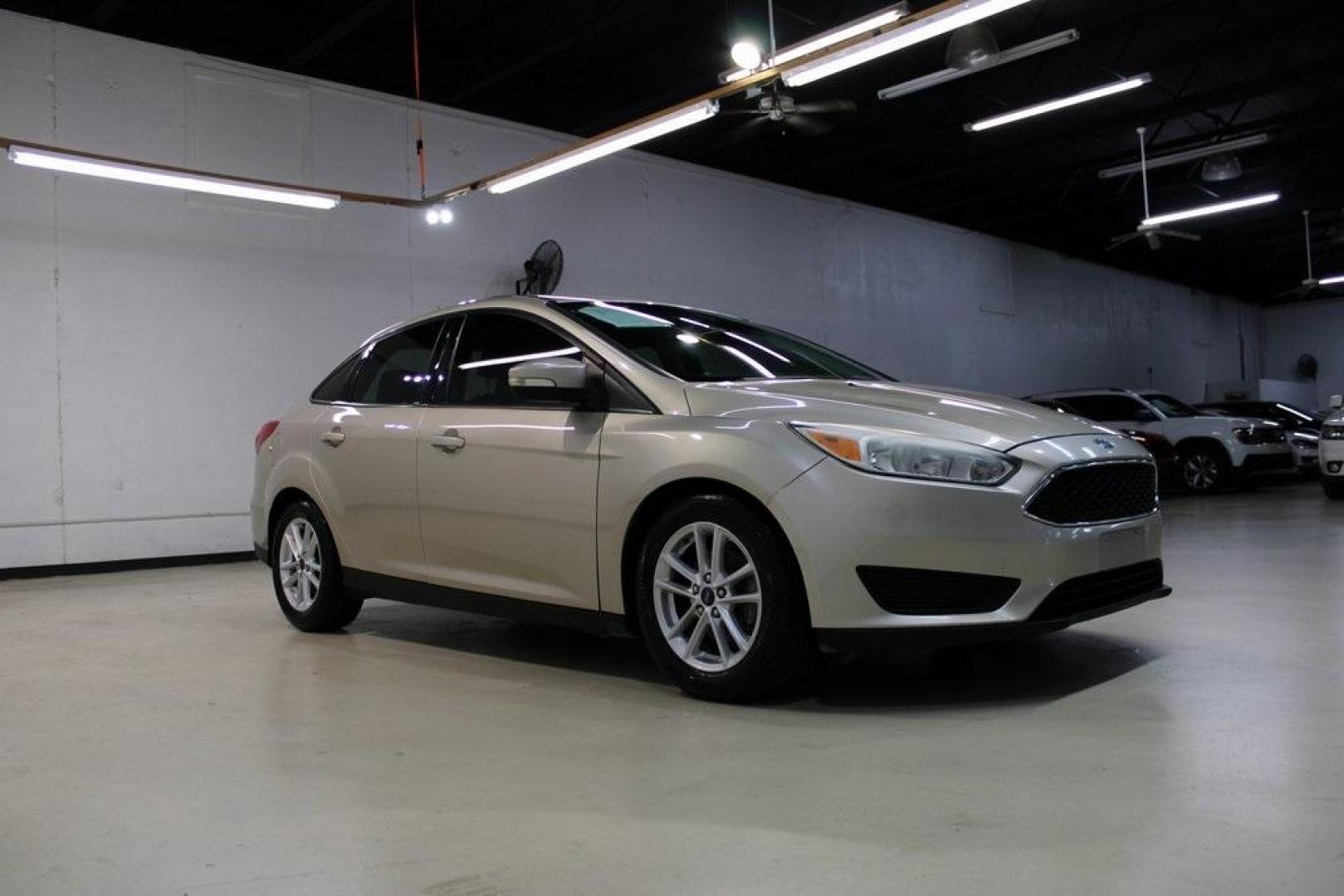 2017 White Gold /Charcoal Black Ford Focus SE (1FADP3F20HL) with an 2.0L 4-Cylinder DGI Flex Fuel Turbocharged DOHC engine, Automatic transmission, located at 15300 Midway Rd., Addison, TX, 75001, (972) 702-0011, 32.958321, -96.838074 - Smart, efficient, and built for everyday life, the 2017 Ford Focus SE offers a dependable and comfortable ride with modern tech and a stylish exterior. Whether you're a commuter or a student, this compact sedan checks all the boxes for affordability, fuel efficiency, and convenience.<br><br>Key Spec - Photo#4
