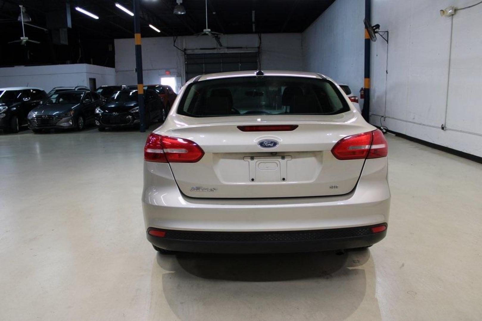 2017 White Gold /Charcoal Black Ford Focus SE (1FADP3F20HL) with an 2.0L 4-Cylinder DGI Flex Fuel Turbocharged DOHC engine, Automatic transmission, located at 15300 Midway Rd., Addison, TX, 75001, (972) 702-0011, 32.958321, -96.838074 - Smart, efficient, and built for everyday life, the 2017 Ford Focus SE offers a dependable and comfortable ride with modern tech and a stylish exterior. Whether you're a commuter or a student, this compact sedan checks all the boxes for affordability, fuel efficiency, and convenience.<br><br>Key Spec - Photo#5