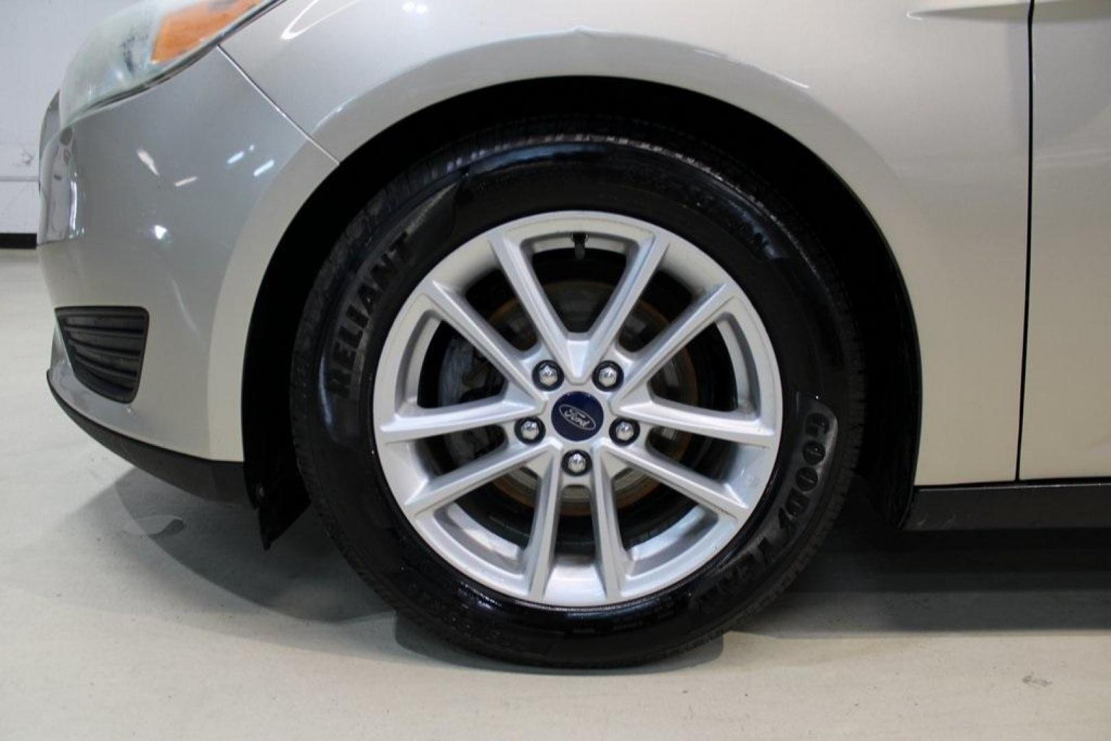 2017 White Gold /Charcoal Black Ford Focus SE (1FADP3F20HL) with an 2.0L 4-Cylinder DGI Flex Fuel Turbocharged DOHC engine, Automatic transmission, located at 15300 Midway Rd., Addison, TX, 75001, (972) 702-0011, 32.958321, -96.838074 - Smart, efficient, and built for everyday life, the 2017 Ford Focus SE offers a dependable and comfortable ride with modern tech and a stylish exterior. Whether you're a commuter or a student, this compact sedan checks all the boxes for affordability, fuel efficiency, and convenience.<br><br>Key Spec - Photo#6