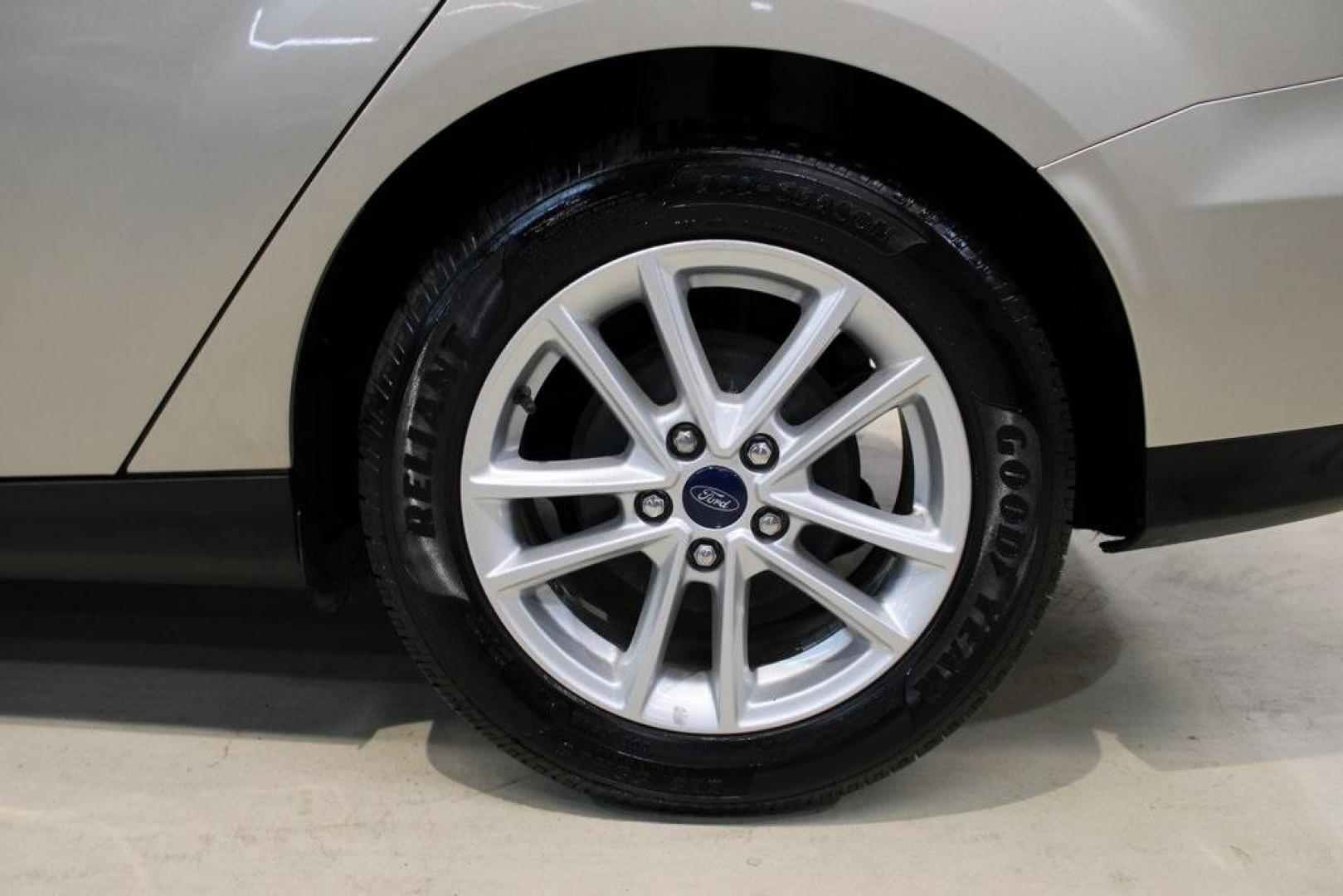2017 White Gold /Charcoal Black Ford Focus SE (1FADP3F20HL) with an 2.0L 4-Cylinder DGI Flex Fuel Turbocharged DOHC engine, Automatic transmission, located at 15300 Midway Rd., Addison, TX, 75001, (972) 702-0011, 32.958321, -96.838074 - Smart, efficient, and built for everyday life, the 2017 Ford Focus SE offers a dependable and comfortable ride with modern tech and a stylish exterior. Whether you're a commuter or a student, this compact sedan checks all the boxes for affordability, fuel efficiency, and convenience.<br><br>Key Spec - Photo#7