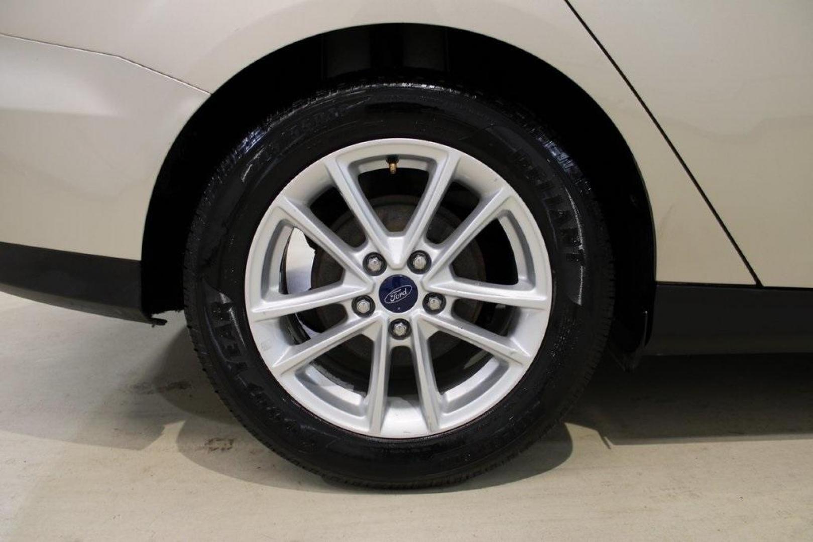 2017 White Gold /Charcoal Black Ford Focus SE (1FADP3F20HL) with an 2.0L 4-Cylinder DGI Flex Fuel Turbocharged DOHC engine, Automatic transmission, located at 15300 Midway Rd., Addison, TX, 75001, (972) 702-0011, 32.958321, -96.838074 - Smart, efficient, and built for everyday life, the 2017 Ford Focus SE offers a dependable and comfortable ride with modern tech and a stylish exterior. Whether you're a commuter or a student, this compact sedan checks all the boxes for affordability, fuel efficiency, and convenience.<br><br>Key Spec - Photo#8