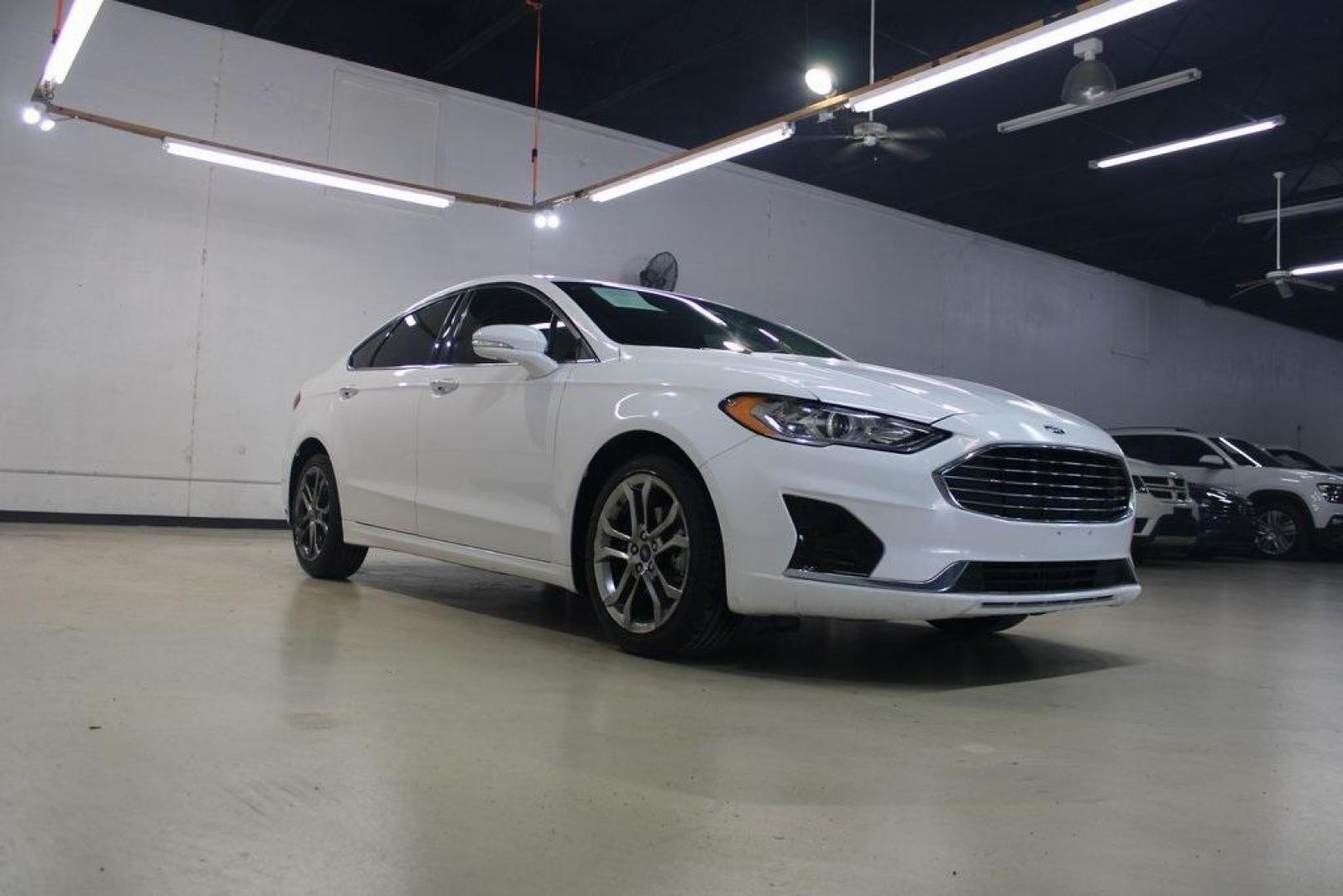 2020 Oxford White /Medium Light Stone Ford Fusion SEL (3FA6P0CD5LR) with an 1.5L EcoBoost engine, Automatic transmission, located at 15300 Midway Rd., Addison, TX, 75001, (972) 702-0011, 32.958321, -96.838074 - Introducing the 2020 Ford Fusion SE, now available at Midway Auto Group in Addison, Texas. This midsize sedan offers a harmonious blend of performance, comfort, and advanced technology, making it an ideal choice for discerning drivers seeking both style and substance.<br><br>Key Specifications:<br>< - Photo#1