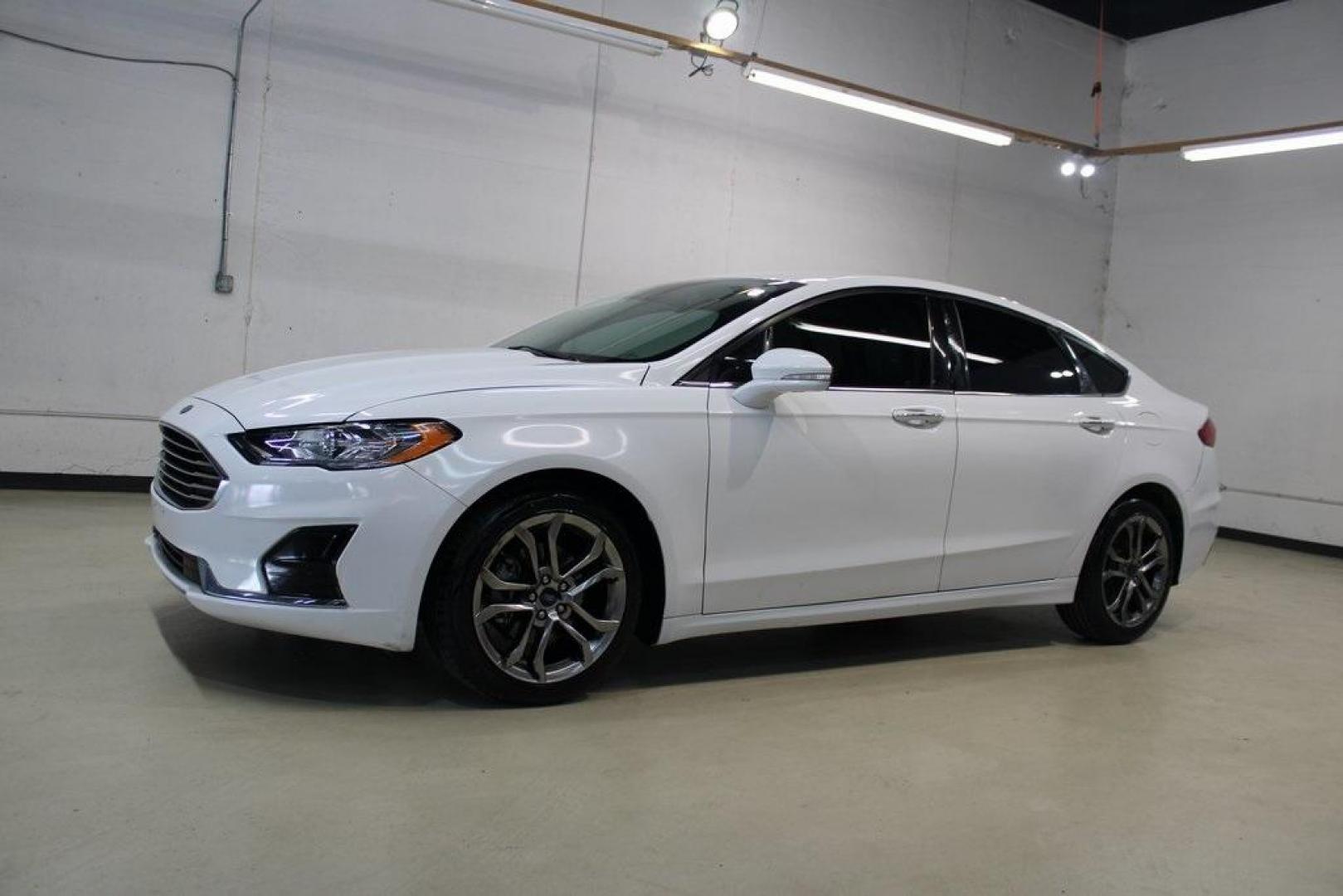2020 Oxford White /Medium Light Stone Ford Fusion SEL (3FA6P0CD5LR) with an 1.5L EcoBoost engine, Automatic transmission, located at 15300 Midway Rd., Addison, TX, 75001, (972) 702-0011, 32.958321, -96.838074 - Introducing the 2020 Ford Fusion SE, now available at Midway Auto Group in Addison, Texas. This midsize sedan offers a harmonious blend of performance, comfort, and advanced technology, making it an ideal choice for discerning drivers seeking both style and substance.<br><br>Key Specifications:<br>< - Photo#4
