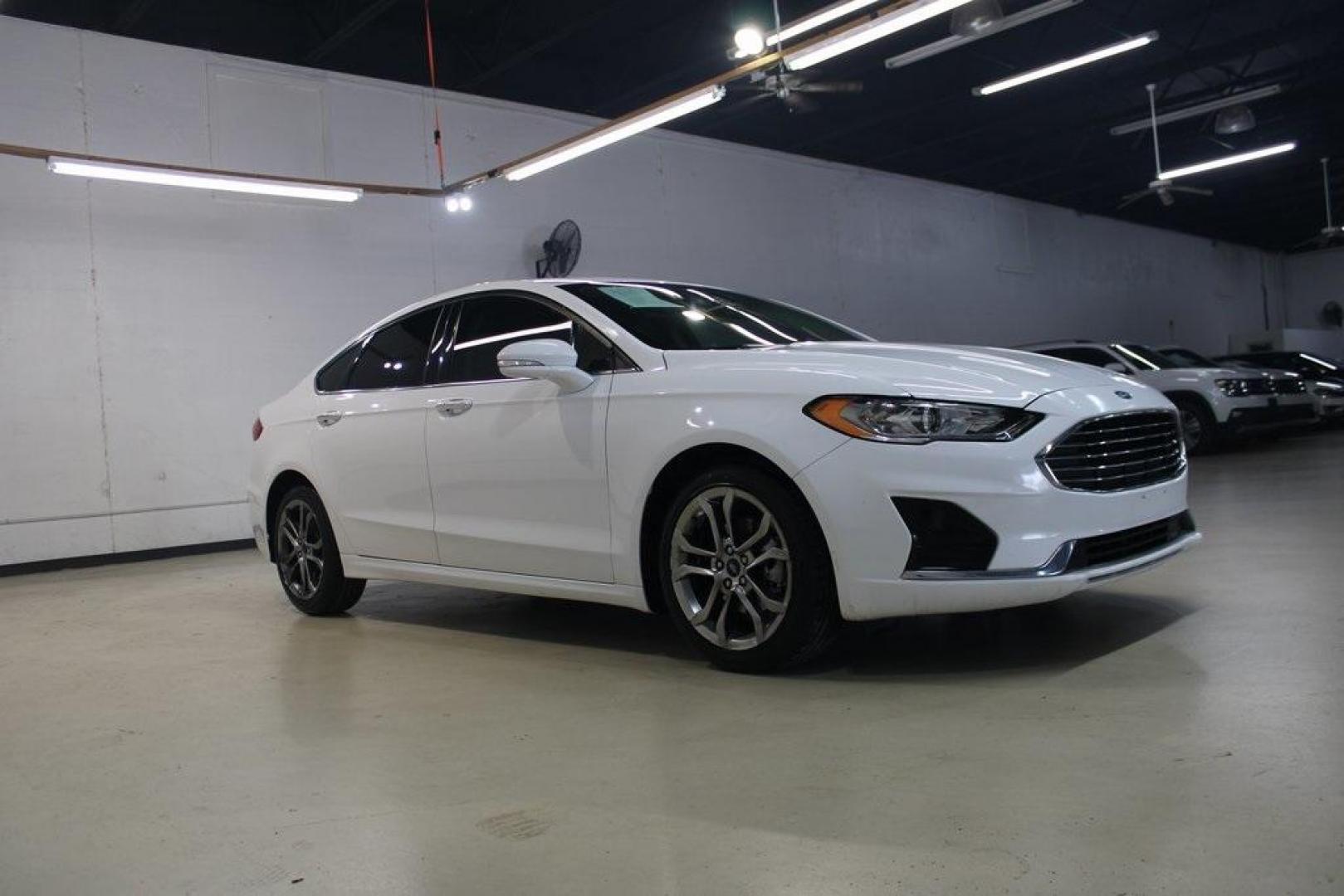 2020 Oxford White /Medium Light Stone Ford Fusion SEL (3FA6P0CD5LR) with an 1.5L EcoBoost engine, Automatic transmission, located at 15300 Midway Rd., Addison, TX, 75001, (972) 702-0011, 32.958321, -96.838074 - Introducing the 2020 Ford Fusion SE, now available at Midway Auto Group in Addison, Texas. This midsize sedan offers a harmonious blend of performance, comfort, and advanced technology, making it an ideal choice for discerning drivers seeking both style and substance.<br><br>Key Specifications:<br>< - Photo#6