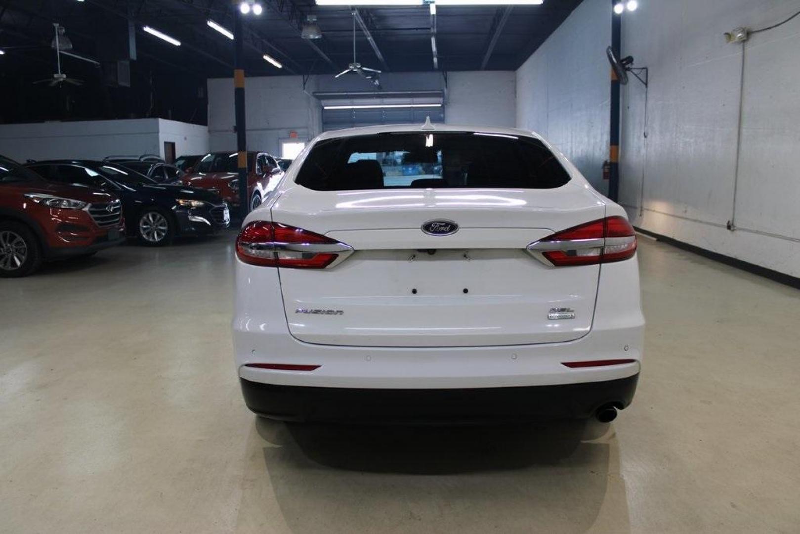 2020 Oxford White /Medium Light Stone Ford Fusion SEL (3FA6P0CD5LR) with an 1.5L EcoBoost engine, Automatic transmission, located at 15300 Midway Rd., Addison, TX, 75001, (972) 702-0011, 32.958321, -96.838074 - Introducing the 2020 Ford Fusion SE, now available at Midway Auto Group in Addison, Texas. This midsize sedan offers a harmonious blend of performance, comfort, and advanced technology, making it an ideal choice for discerning drivers seeking both style and substance.<br><br>Key Specifications:<br>< - Photo#7